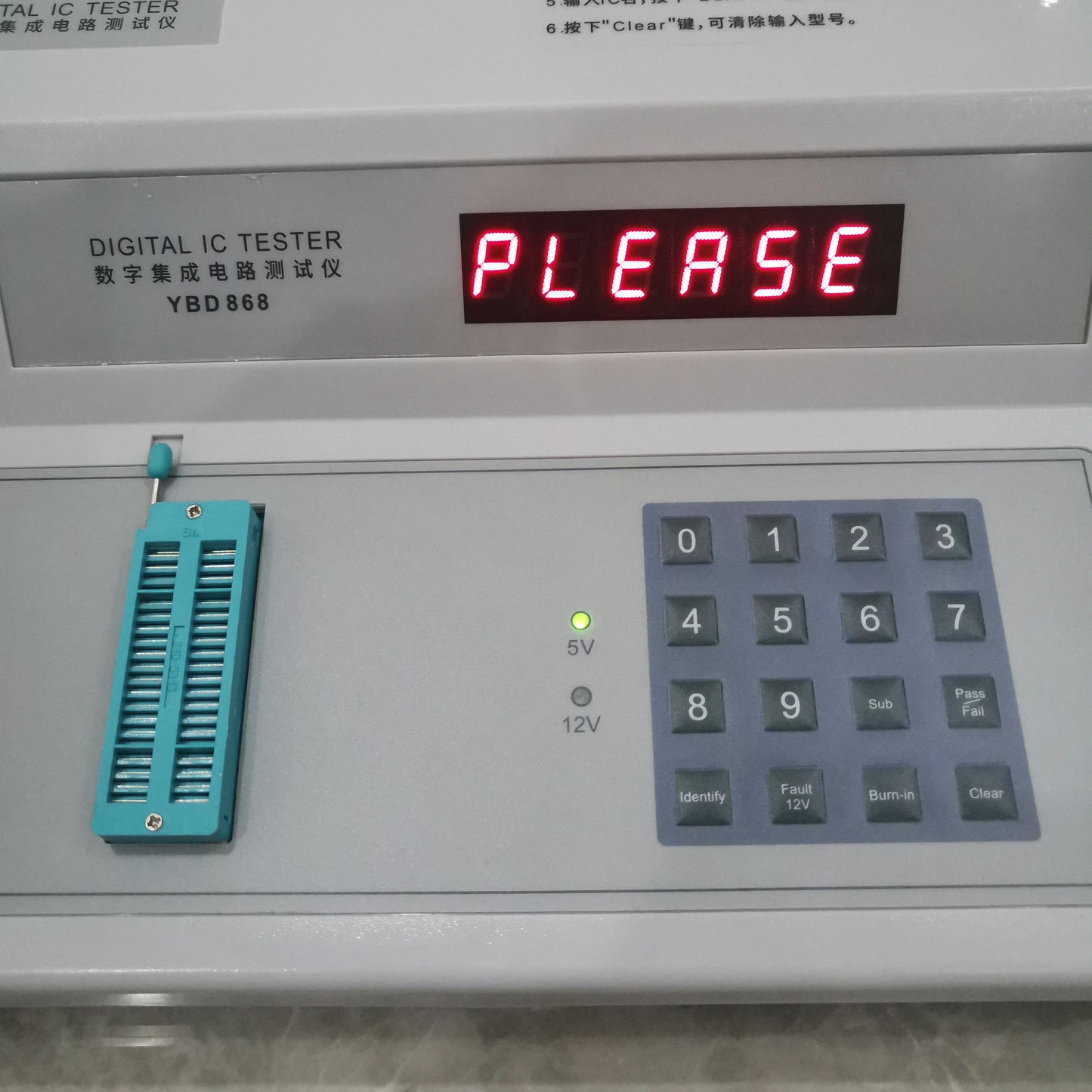 YBD868 digital IC tester close-up showing LED display, 5V indicator, ZIF socket and function keys