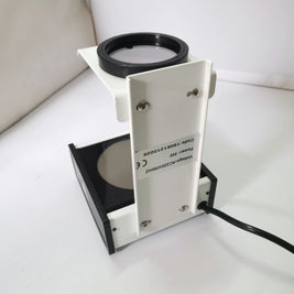 Polarized light lens stress detector for optical strain inspection in finished glasses