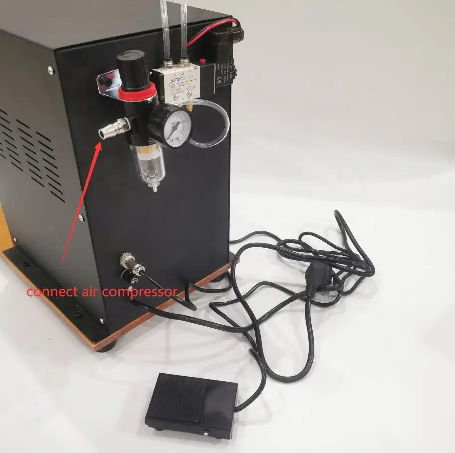 Rear air regulator and air compressor connection on pneumatic spot welder