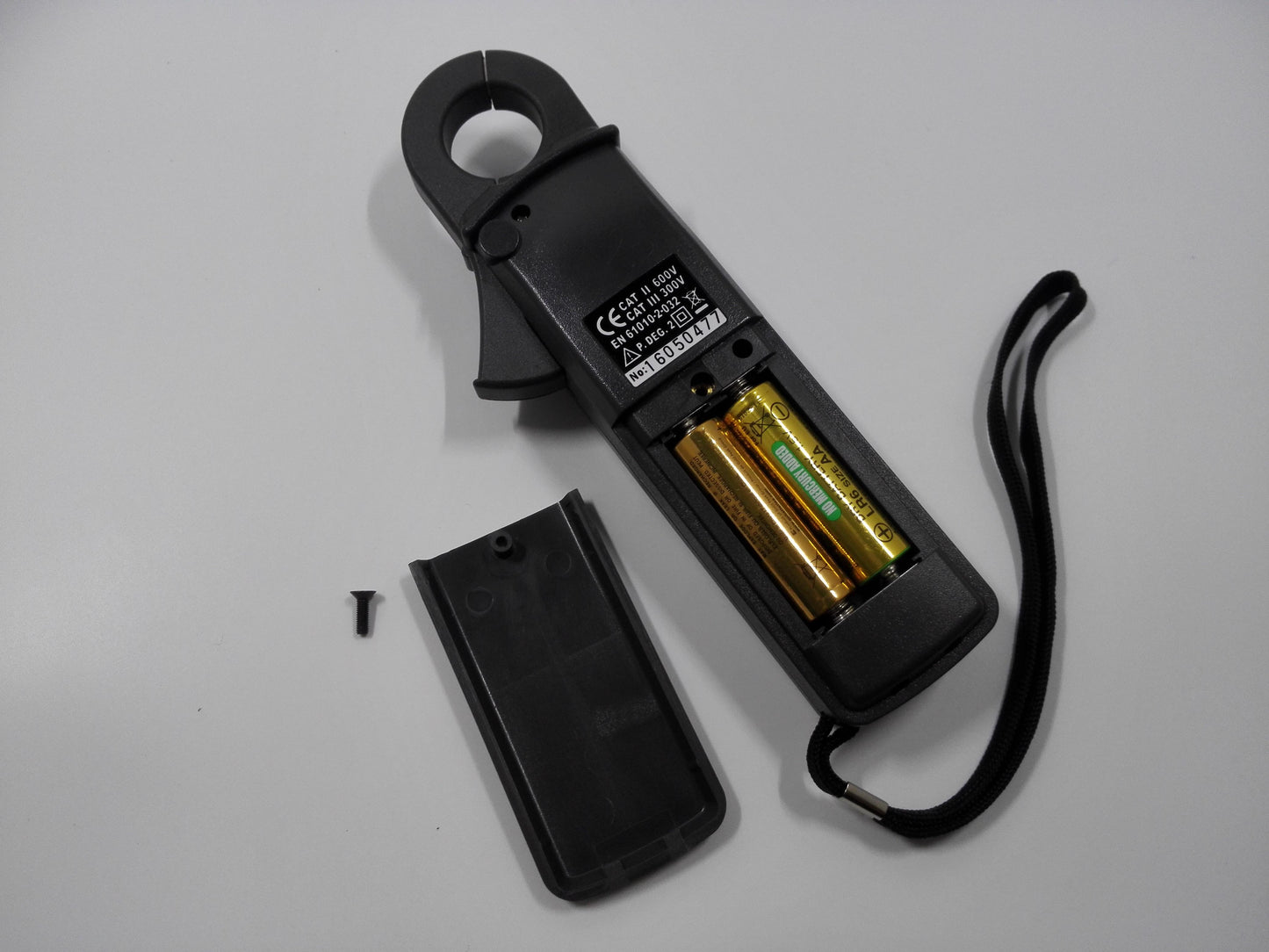 PROVA CM-07 clamp meter battery compartment and rear safety label