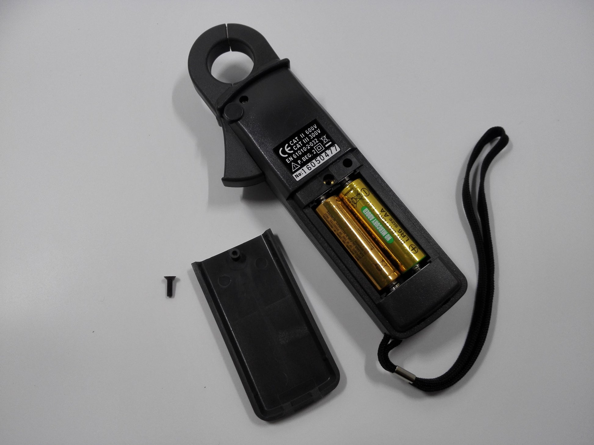 PROVA CM-07 clamp meter battery compartment and rear safety label