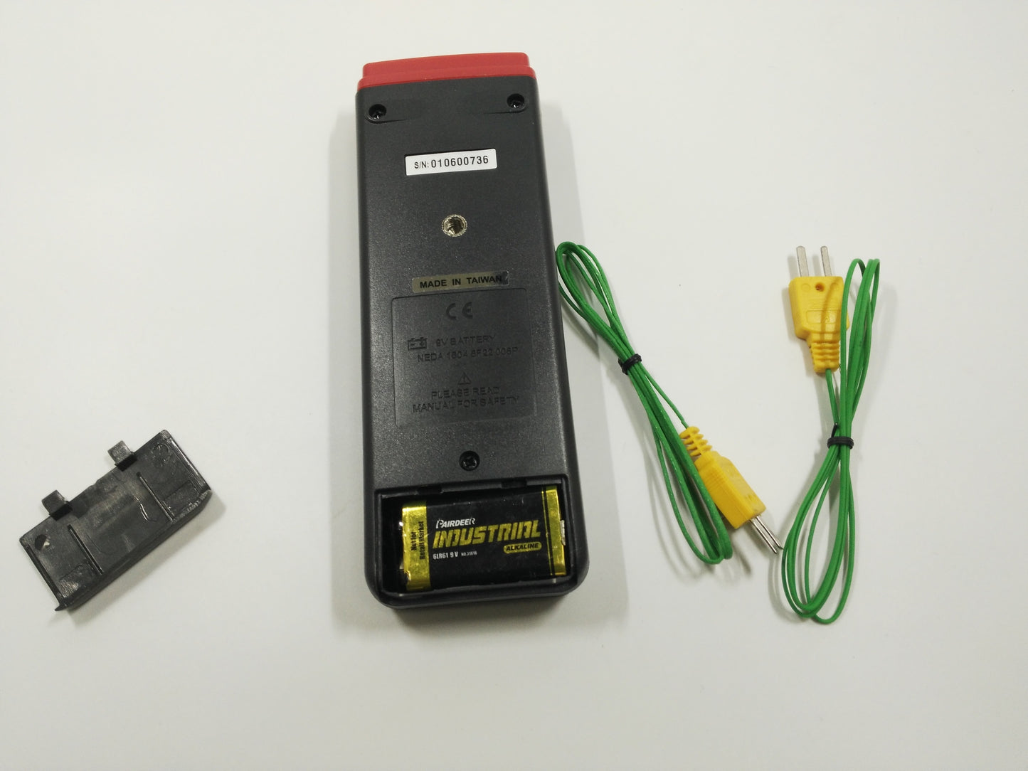 Back view of CENTER 301 thermometer with 9V battery and Type K probe leads