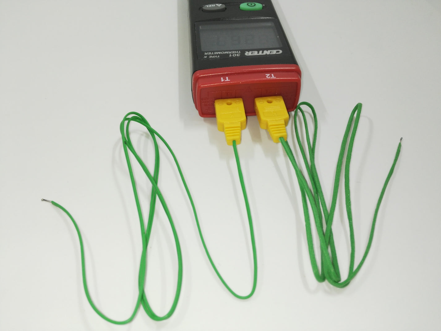 Close-up of CENTER 301 dual thermocouple probe inputs with green Type K leads
