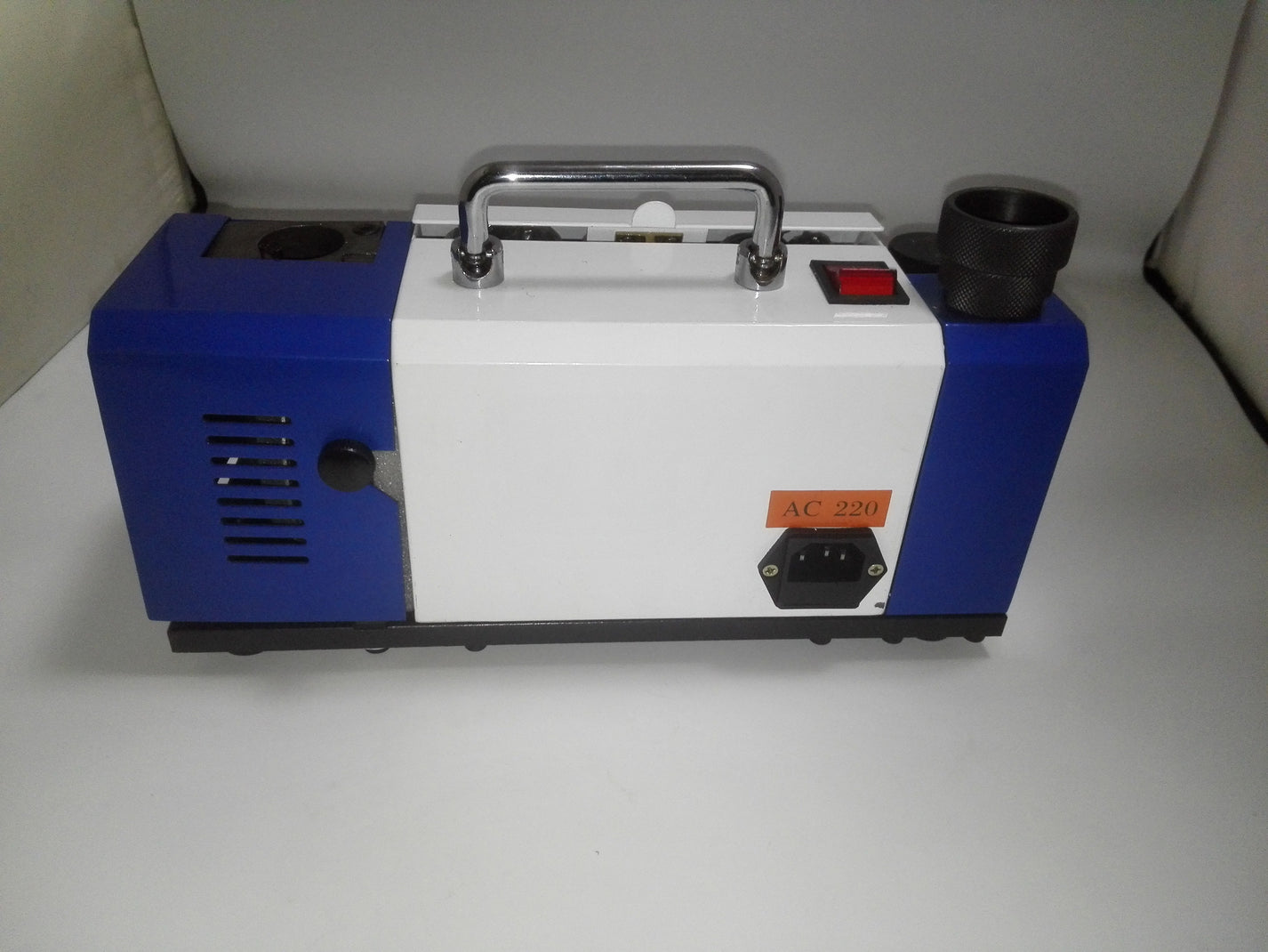 Side view of compact AC 220V drill bit sharpening machine housing