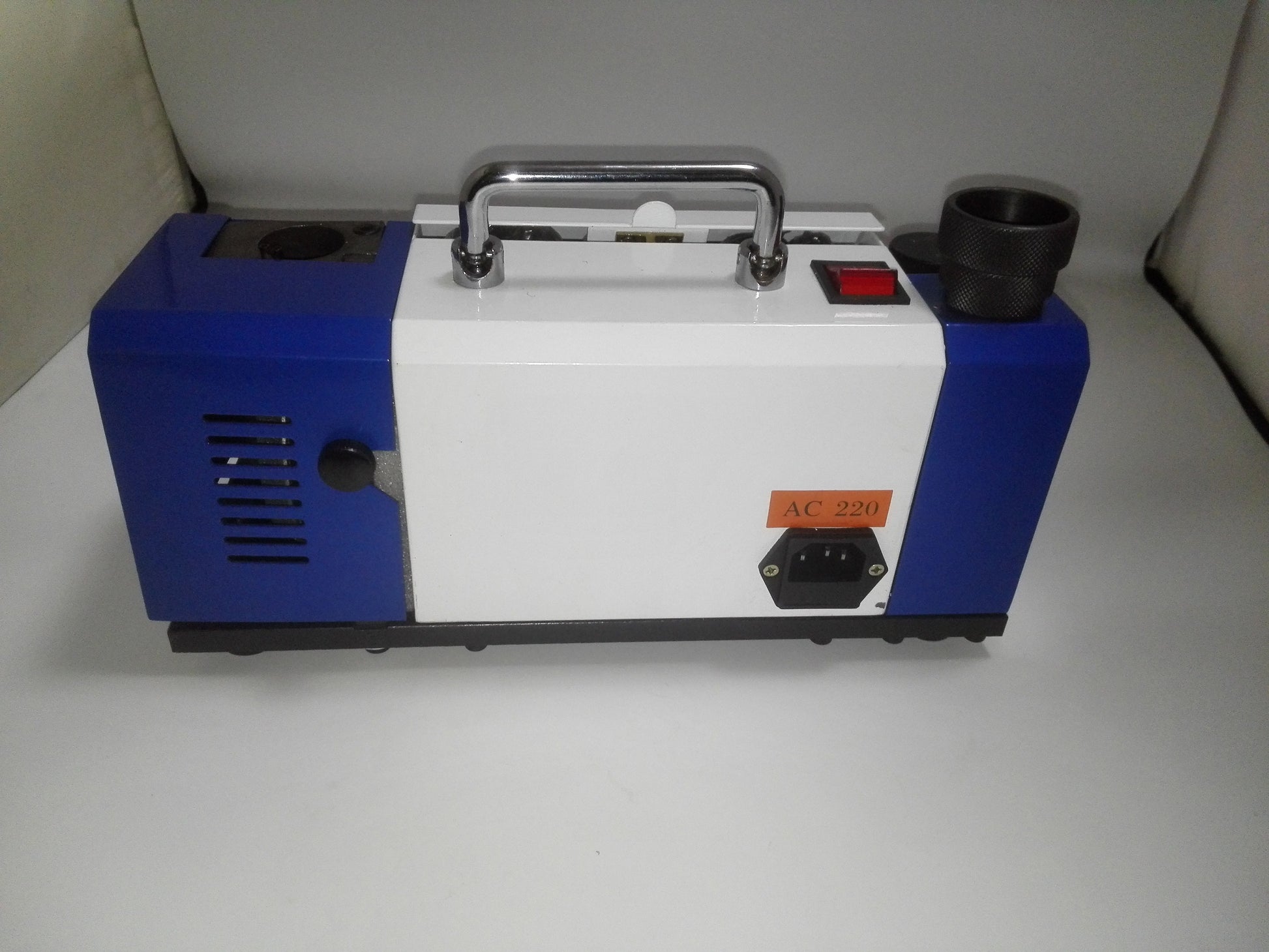Side view of compact AC 220V drill bit sharpening machine housing