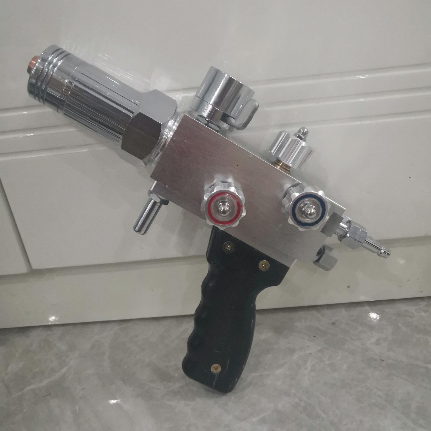 Metal powder spray welding torch body with control knobs and gas fittings