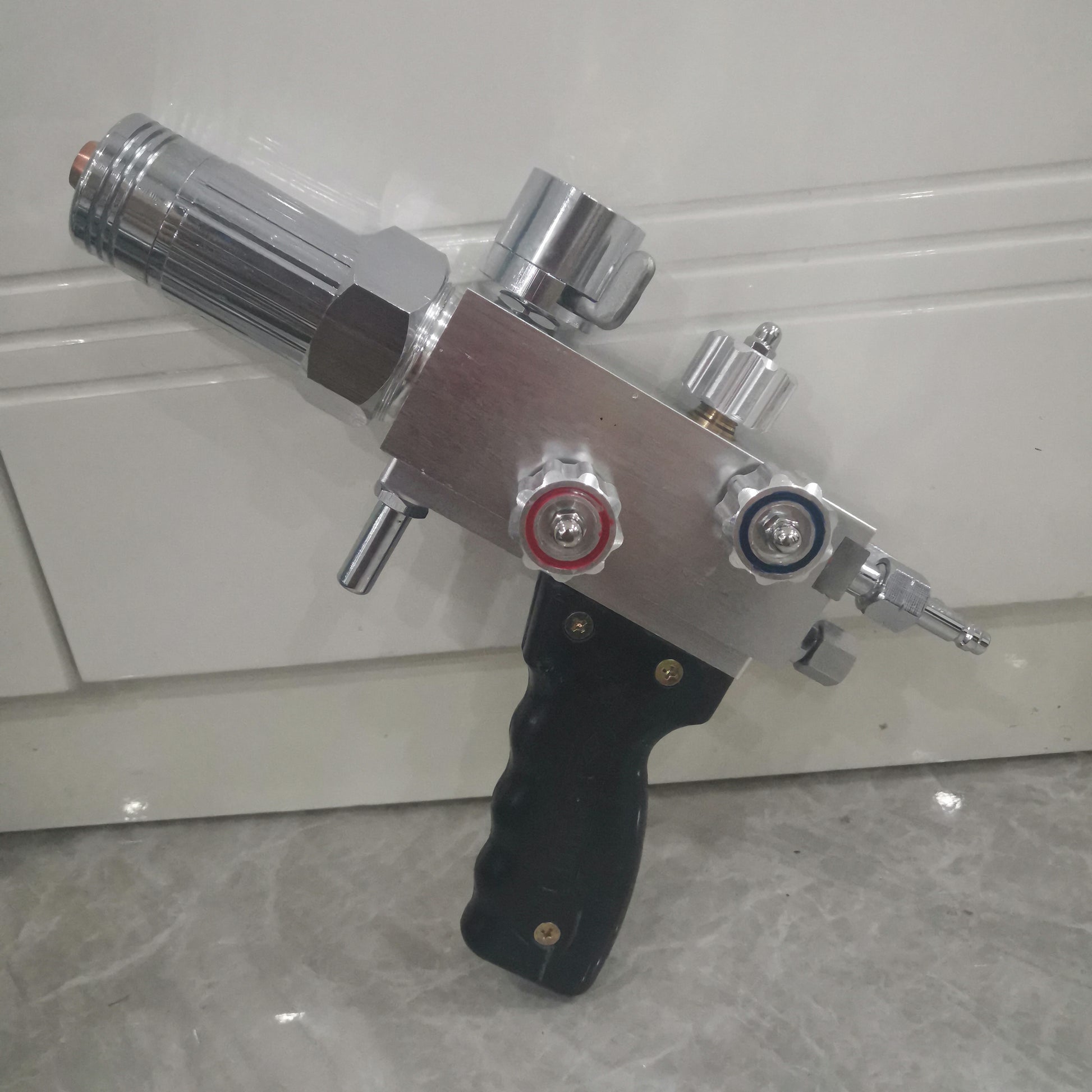 Metal powder spray welding torch body with control knobs and gas fittings