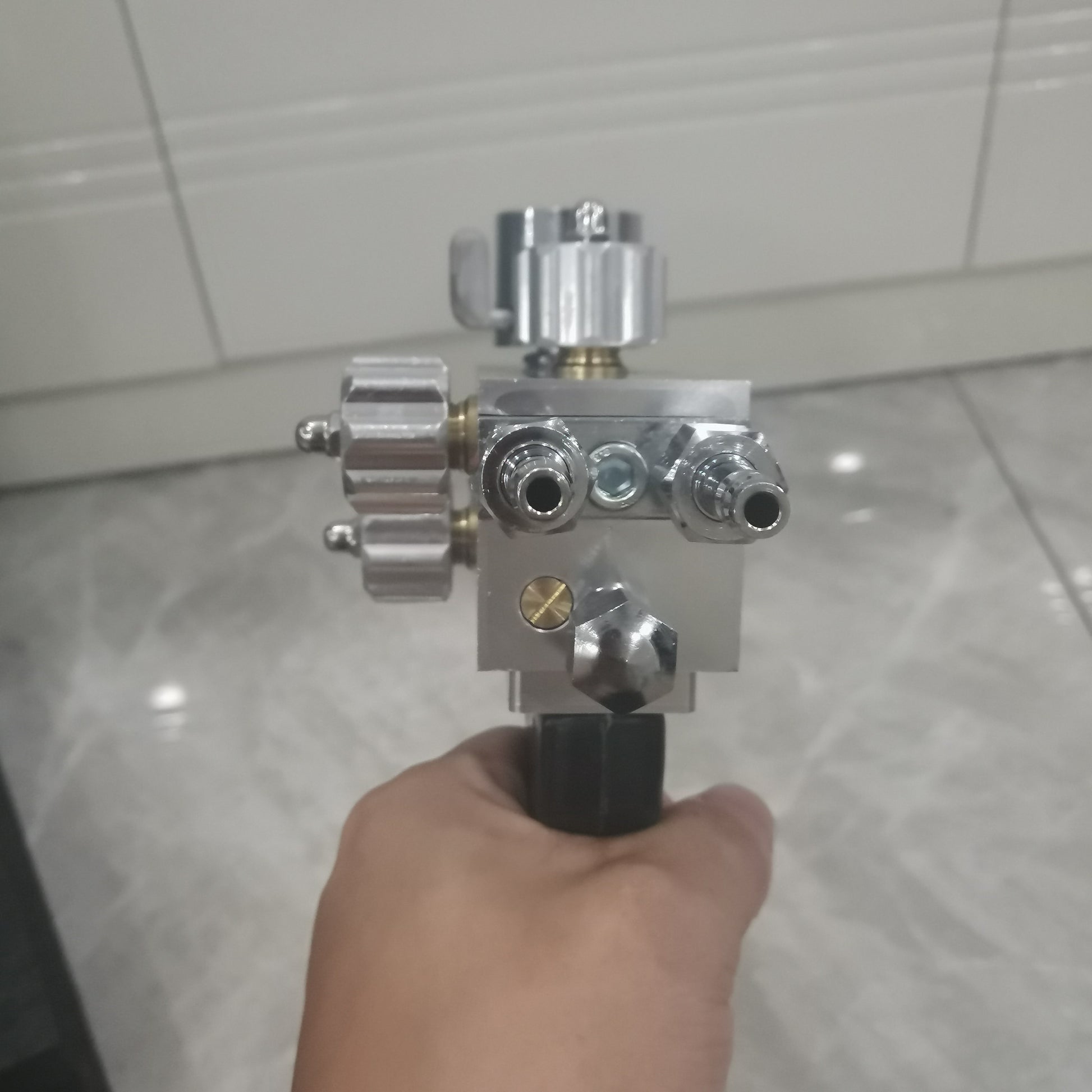 Spray welding torch front fittings and nozzle ports