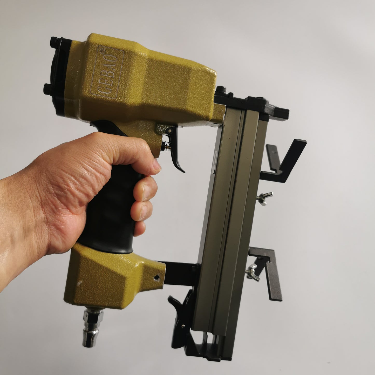 Handheld V1015 air powered V nailer showing grip and frame guide