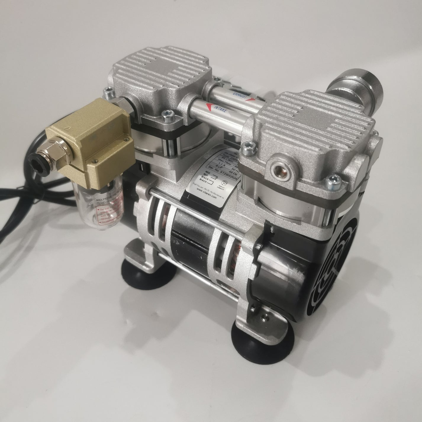 Angled view of oil-free silent lab vacuum pump showing intake and exhaust labels