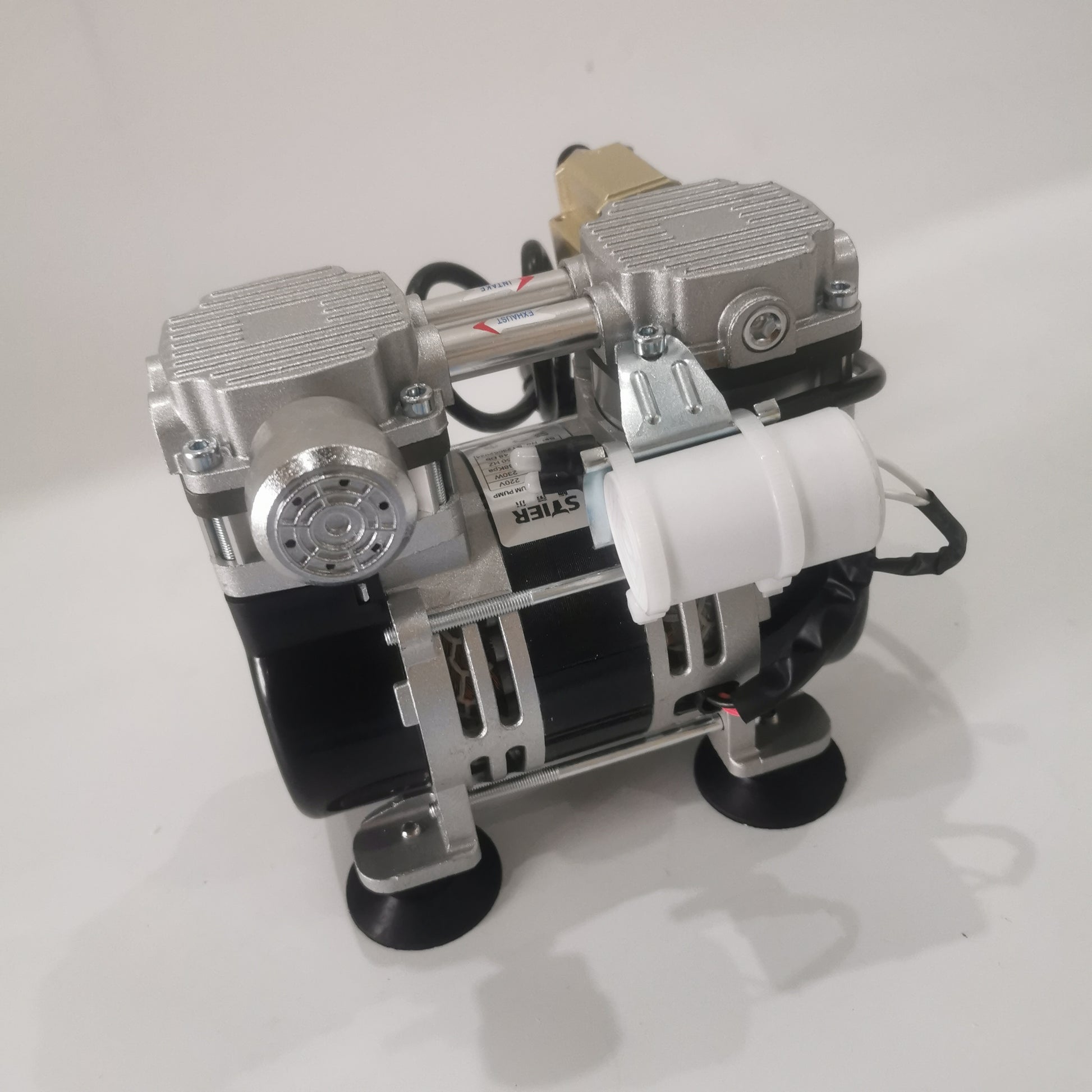 Side view of oil-free silent vacuum pump showing filter housing and motor assembly