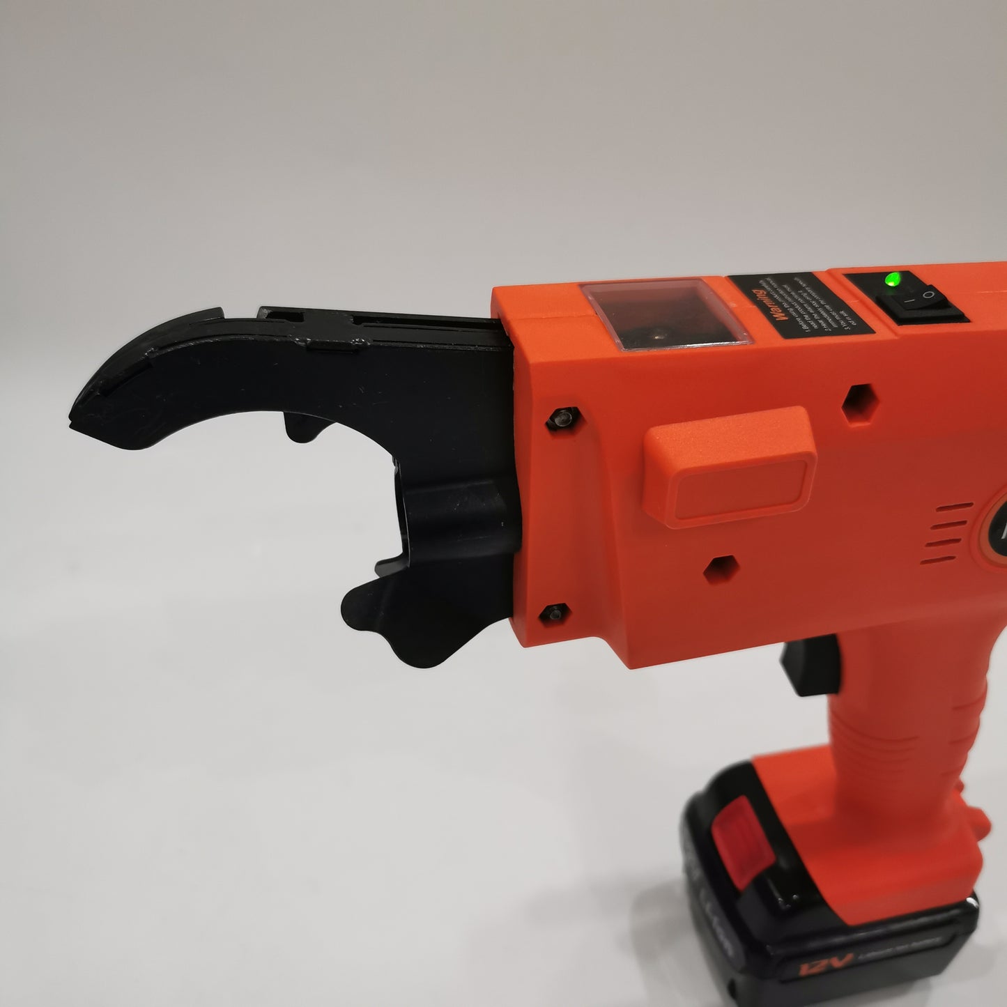 Close-up of rebar tying gun head for steel bar binding work
