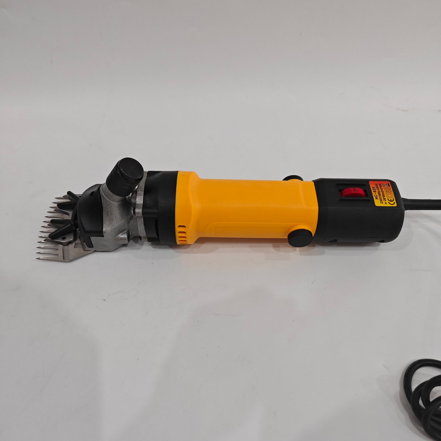 Side view of electric sheep shearing clipper with 76 mm blade and power cord