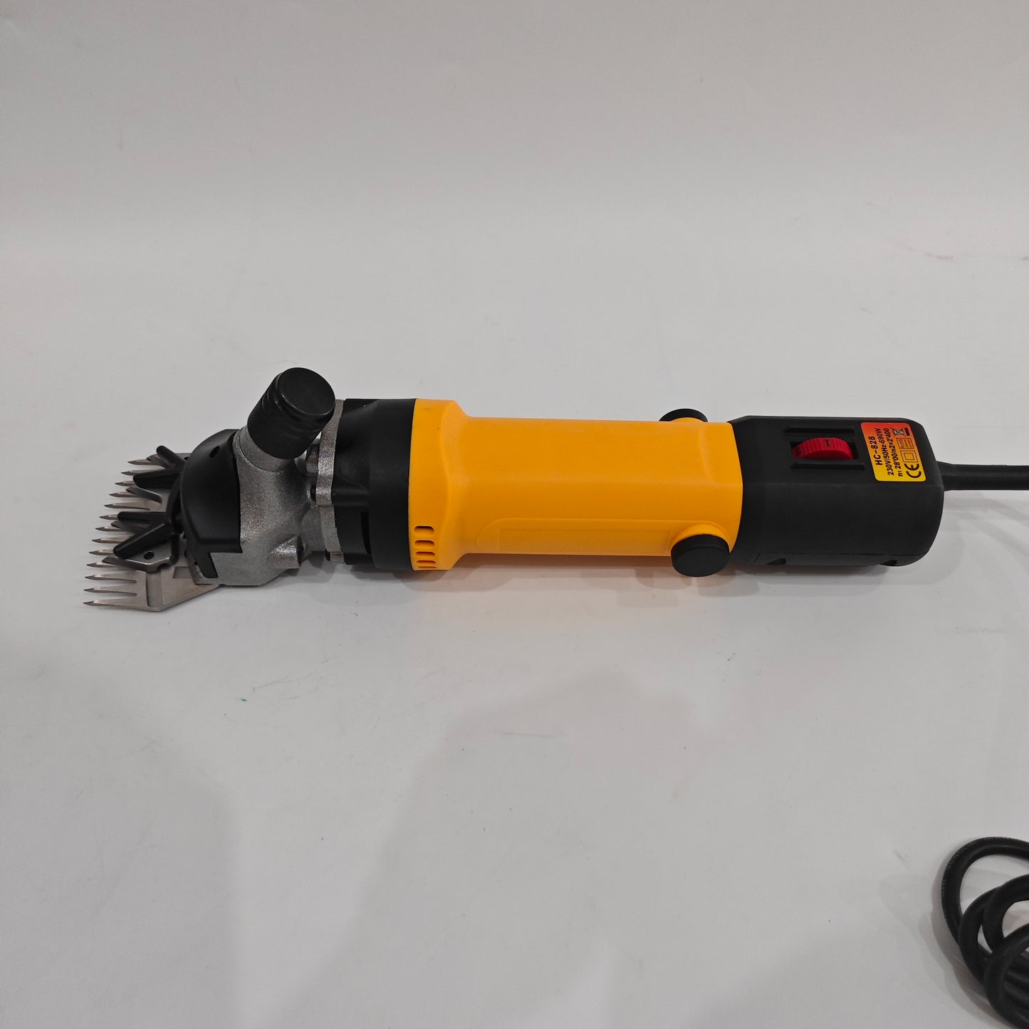 Side view of electric sheep shearing clipper with 76 mm blade and power cord