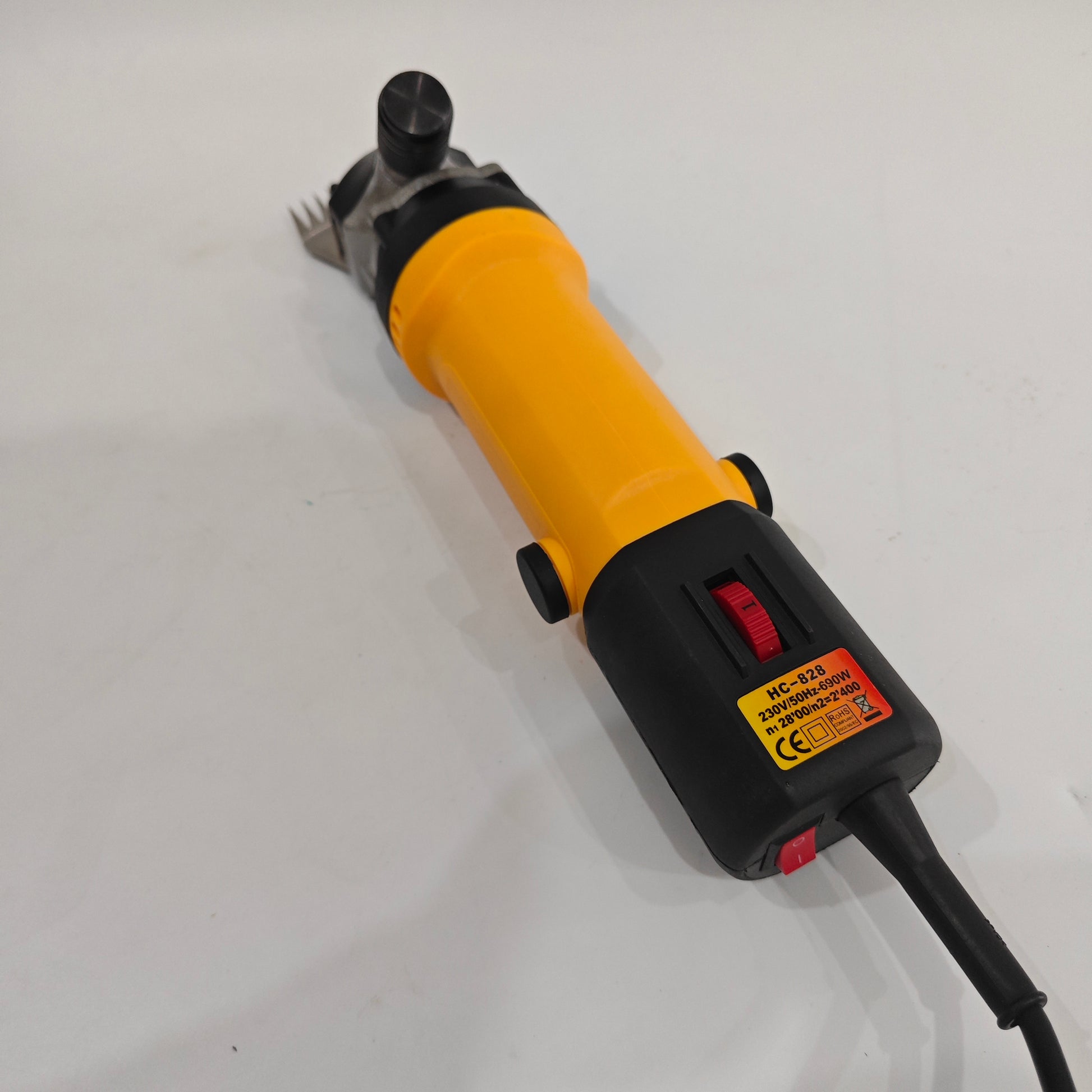 Top view of electric sheep shearing clipper showing speed dial and 690W motor label