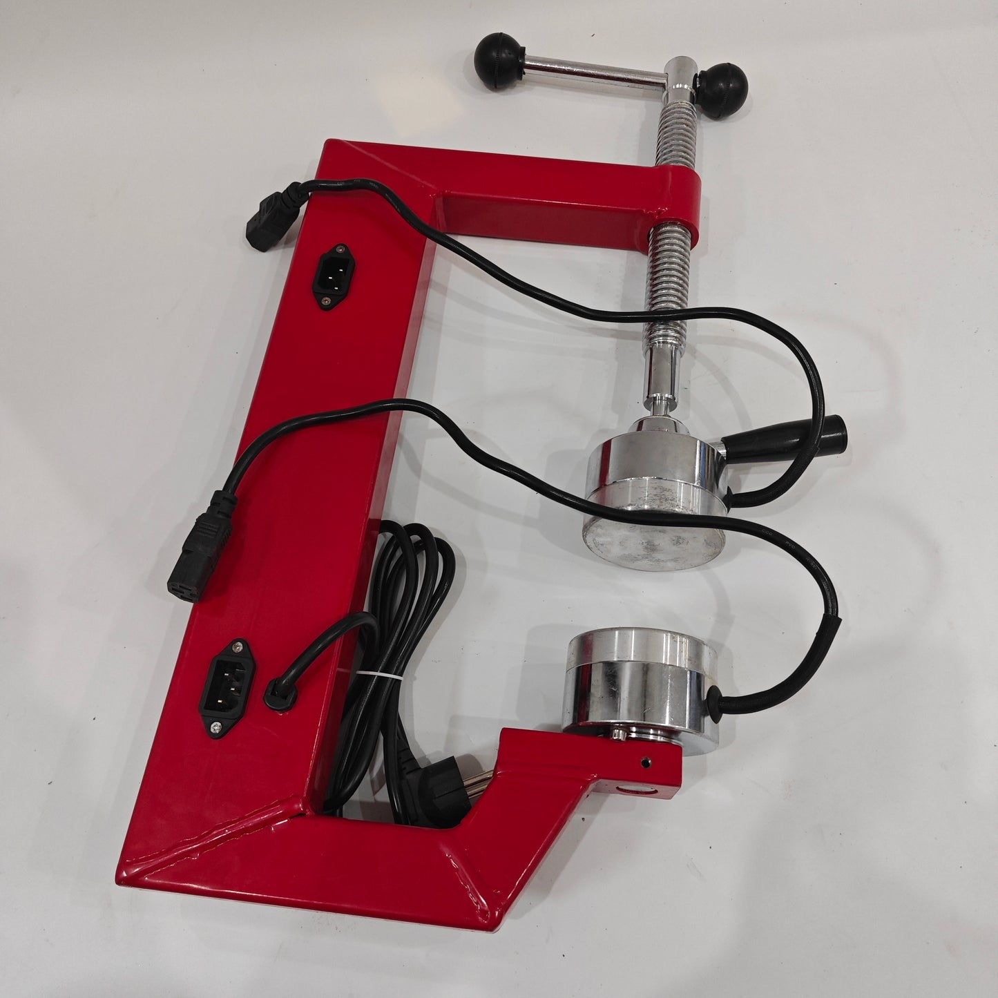 Back view of tire spot vulcanizing machine power sockets and clamp screw