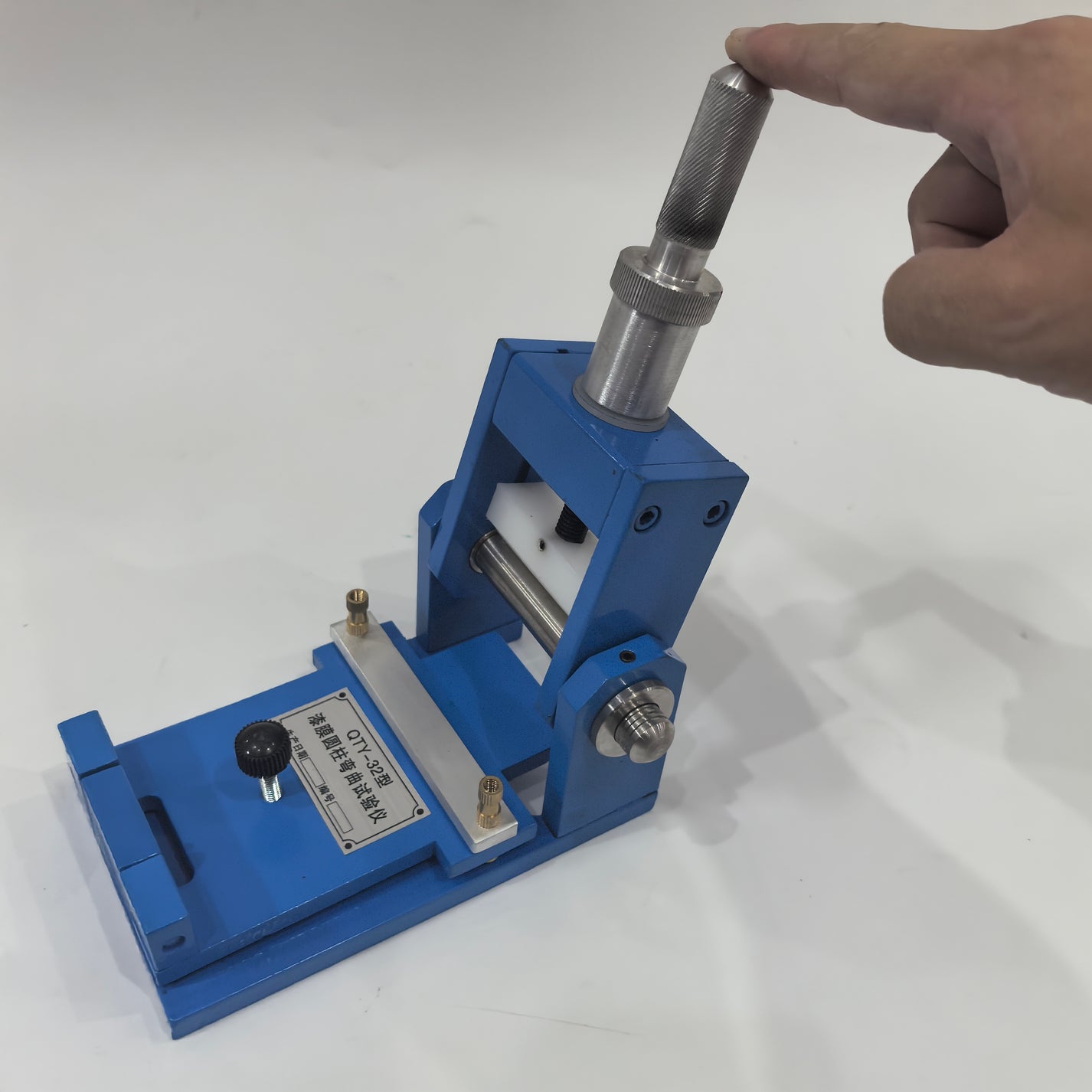 QTY-32 bending tester handle raised for 180 degree mandrel bend operation