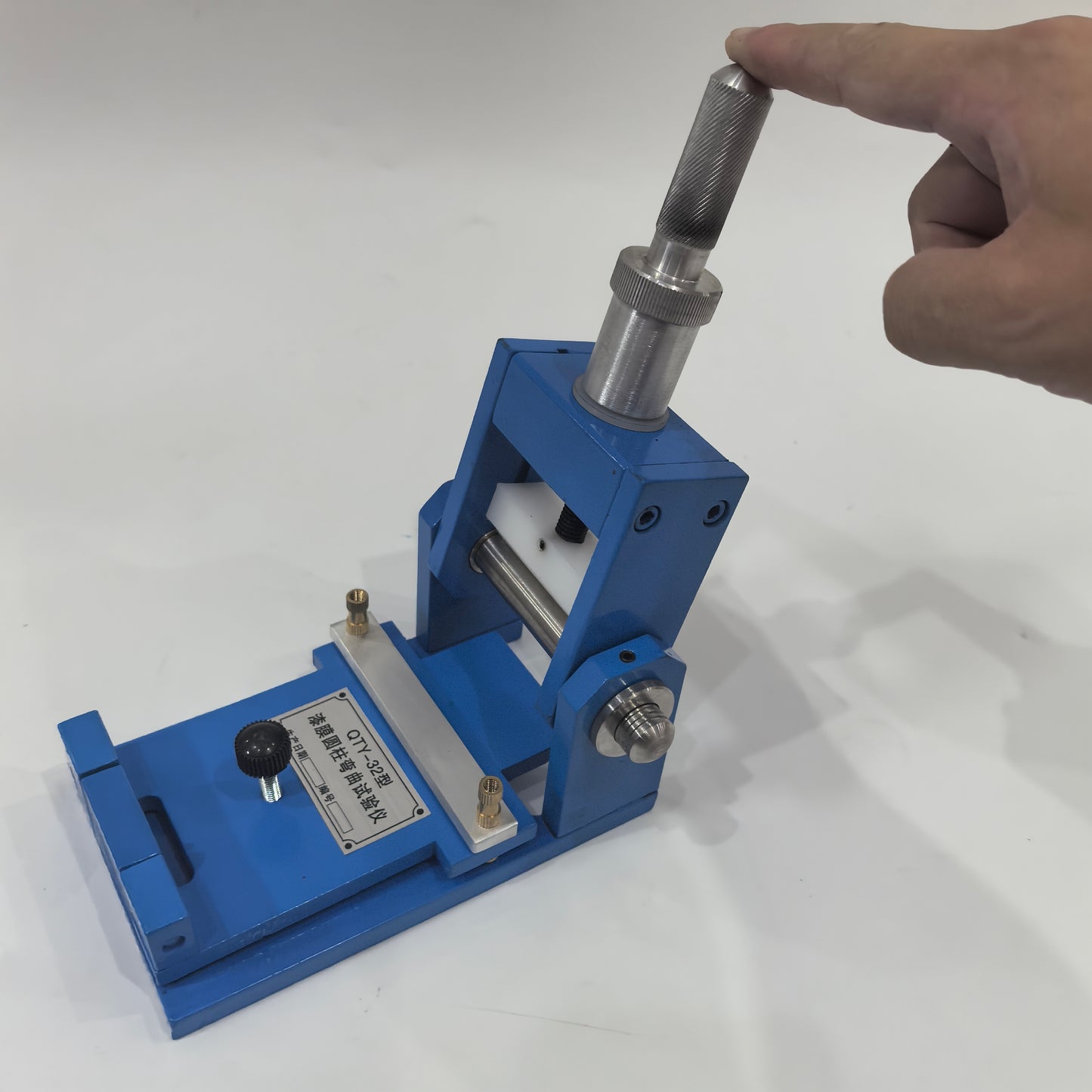 QTY-32 bending tester handle raised for 180 degree mandrel bend operation