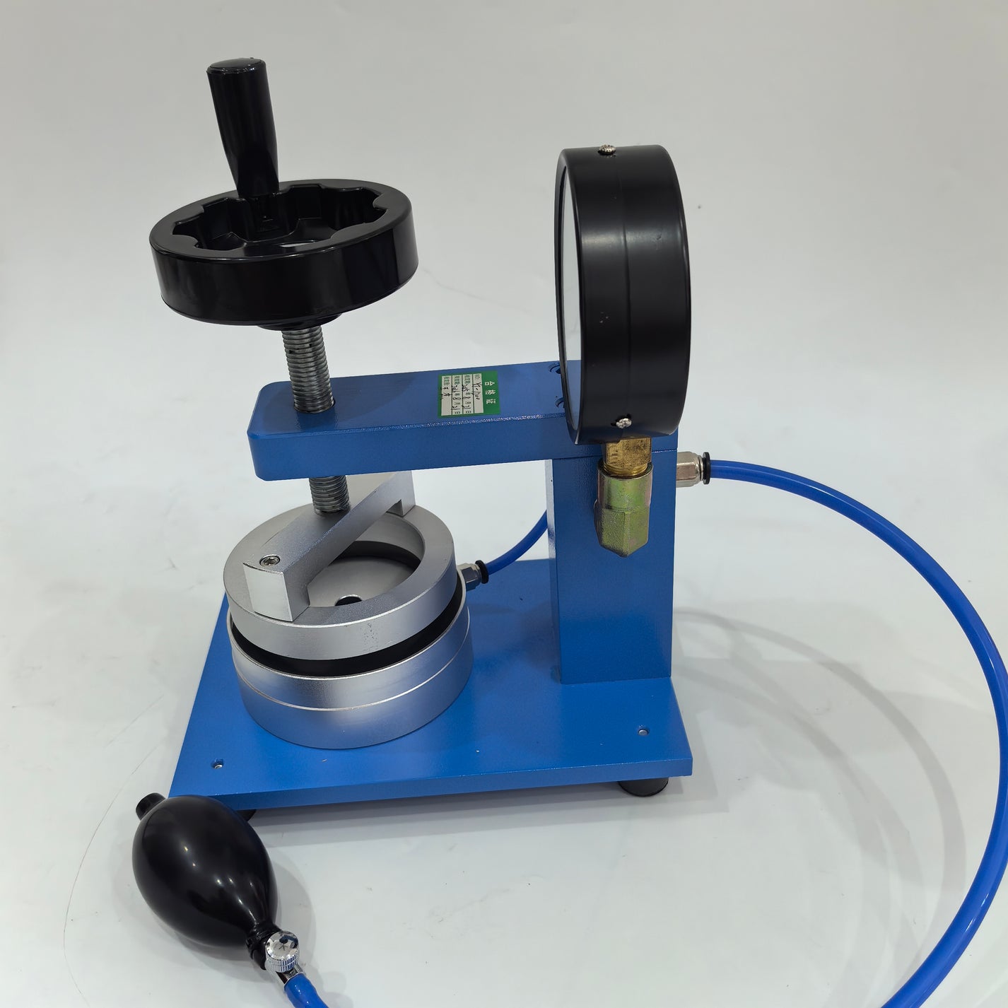 Side view of manual hydrostatic pressure tester with hand pump