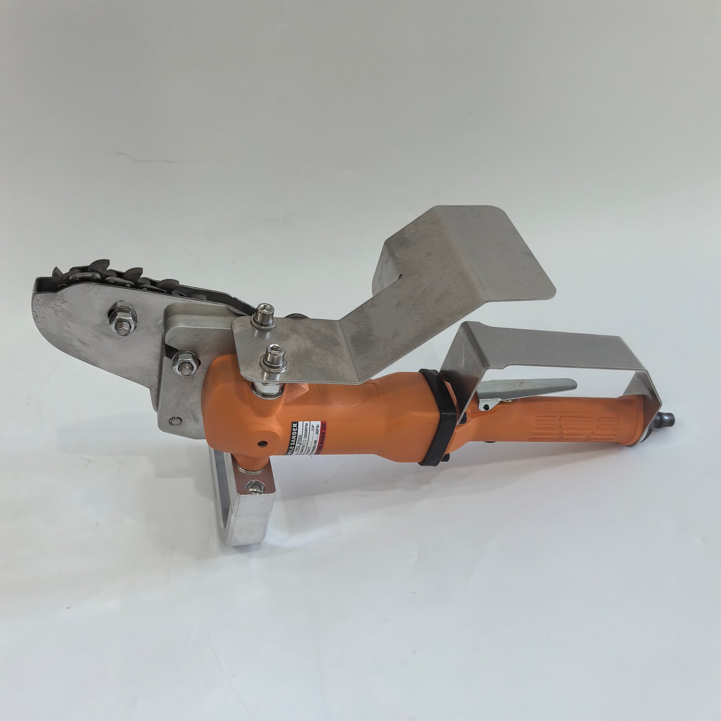 Handheld pneumatic carton waste stripper with metal guard and chain head