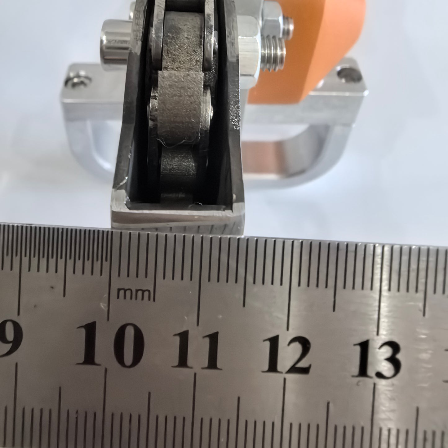 Close-up of 14 mm waste stripping head measured with ruler