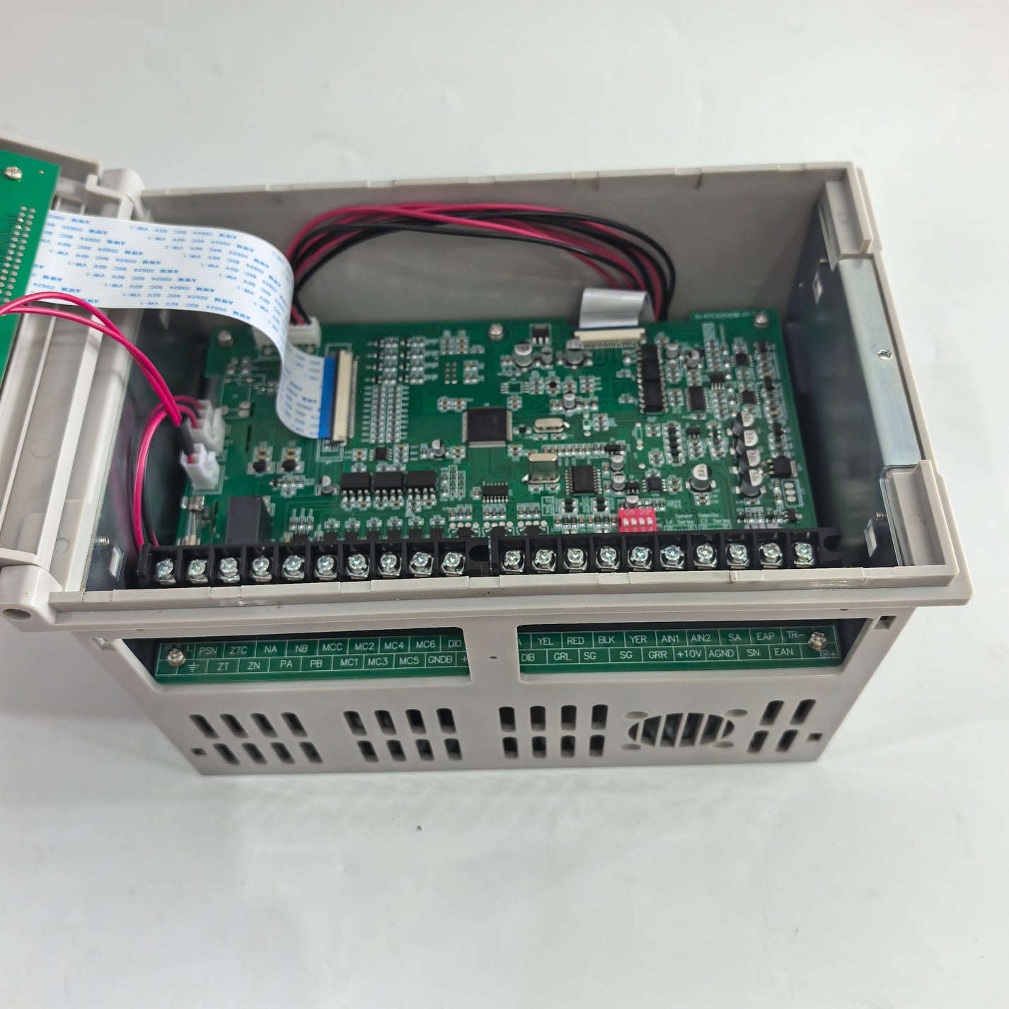 Close-up of the FMF KTC828A controller circuit board, wiring, DIP switches, and screw terminals