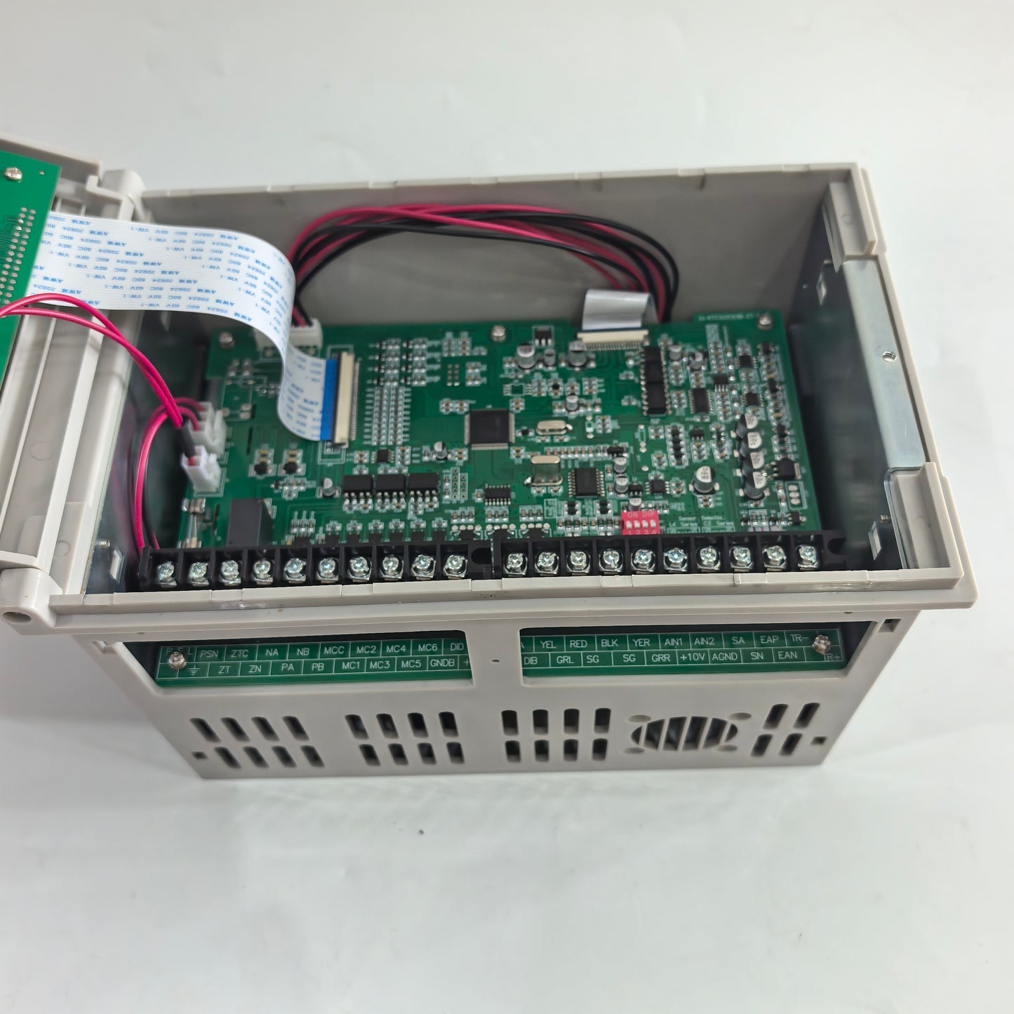 Close-up of the FMF KTC828A controller circuit board, wiring, DIP switches, and screw terminals