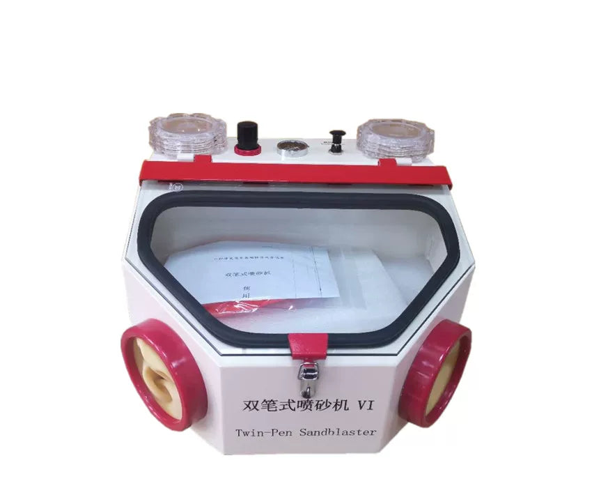 Twin-pen dental sandblaster front view with clear abrasive cups and cabinet window