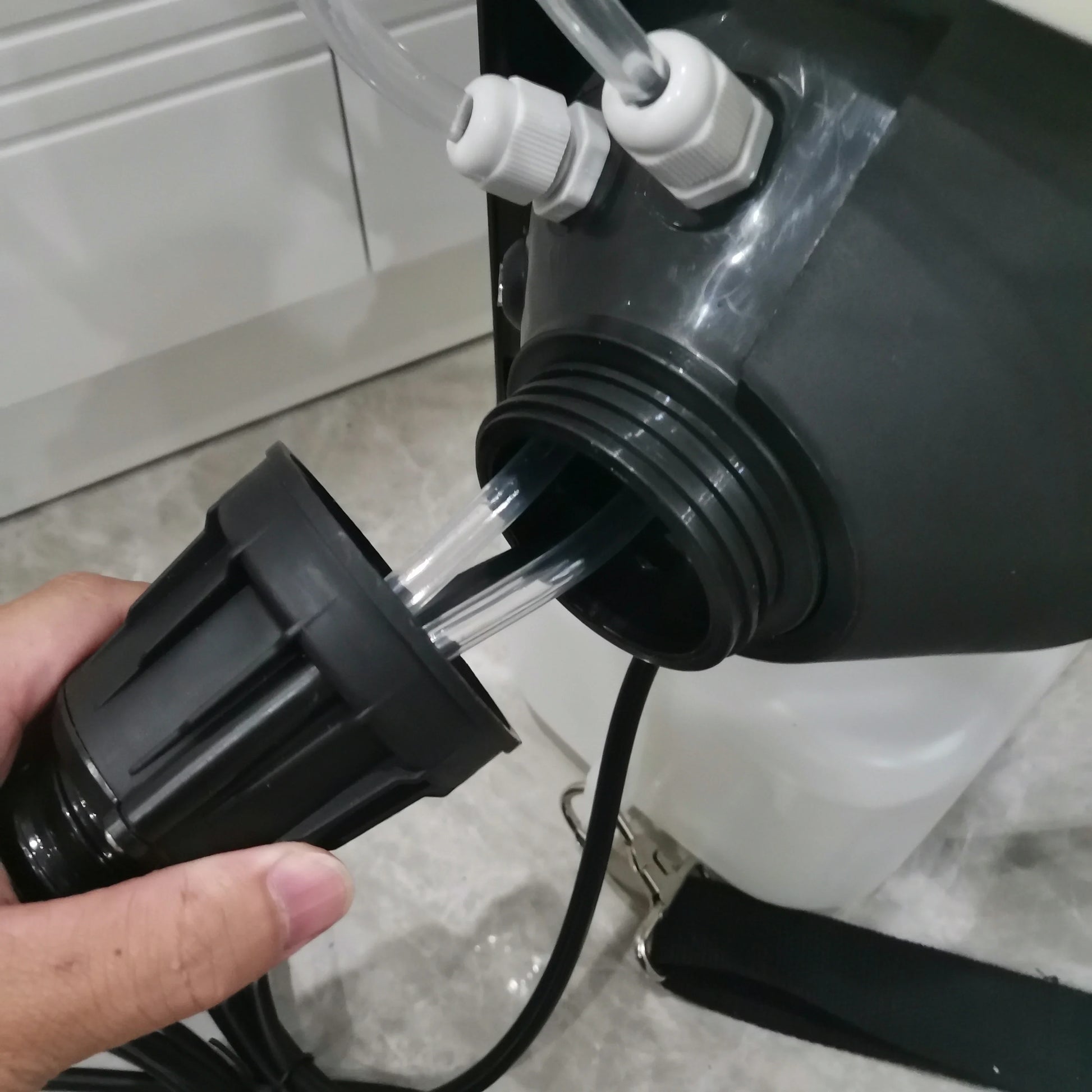 ULV fogger hose connector and transparent tube detail on backpack tank