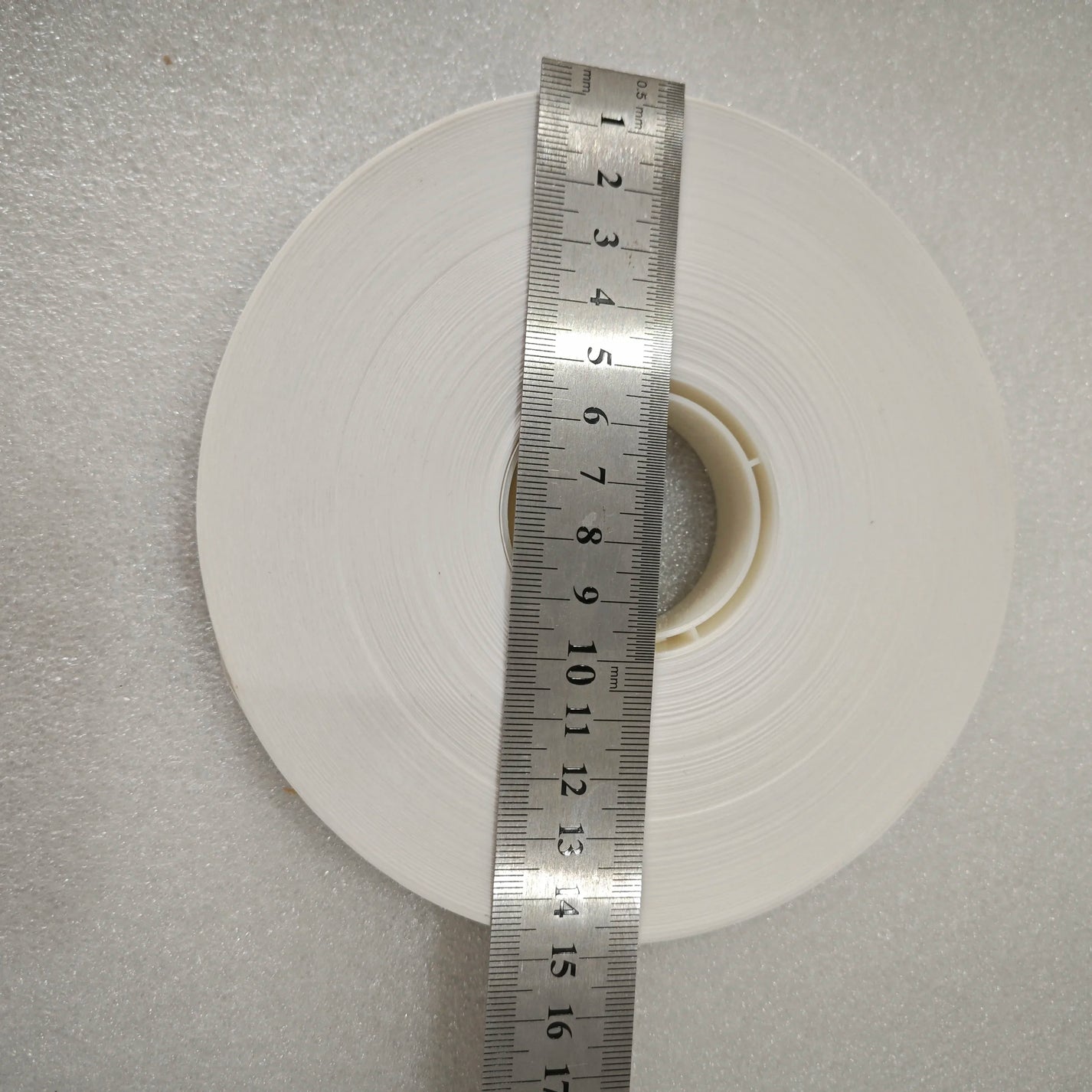 15cm outer diameter banknote banding paper tape roll measured with ruler