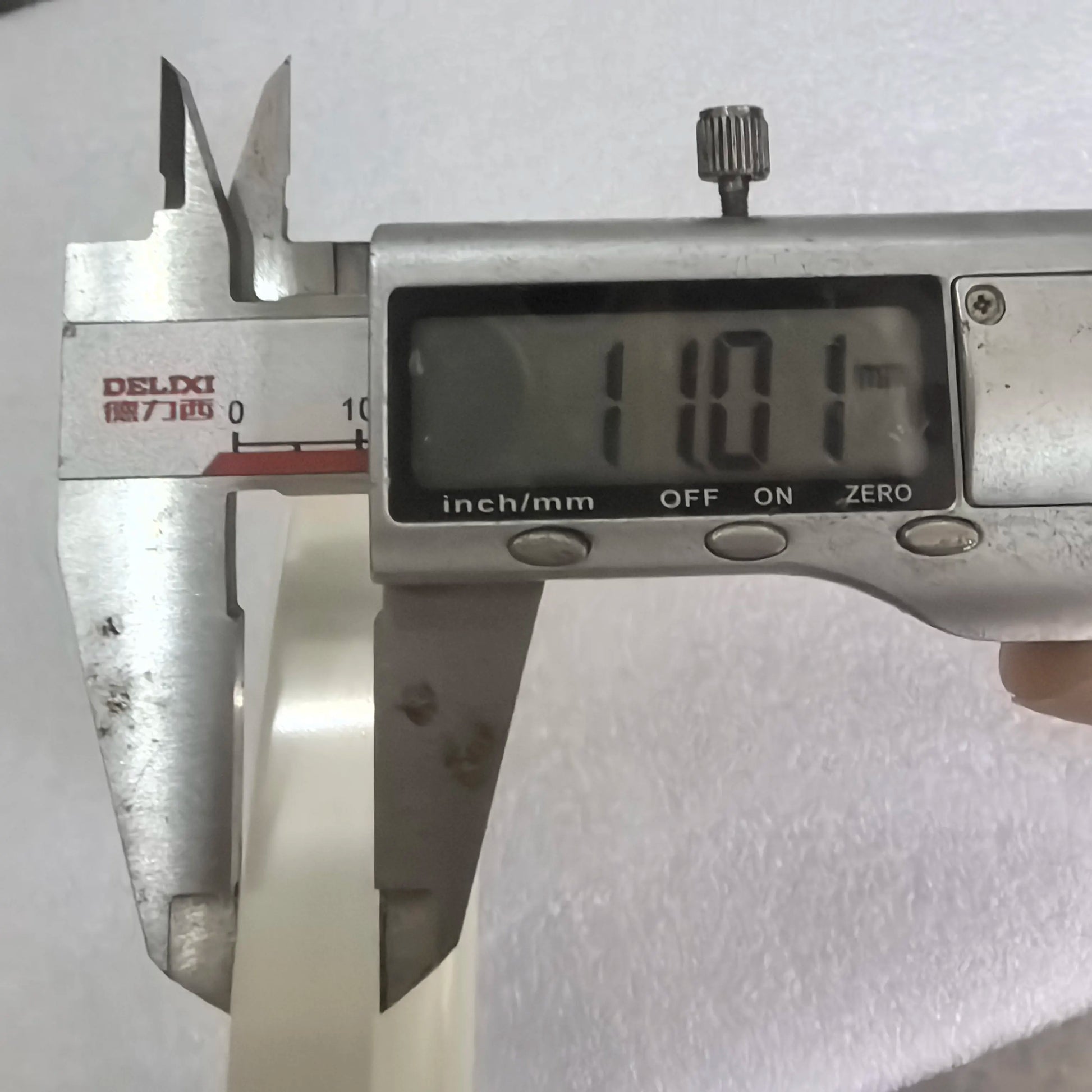 Caliper measurement showing about 11mm OPP banding tape width