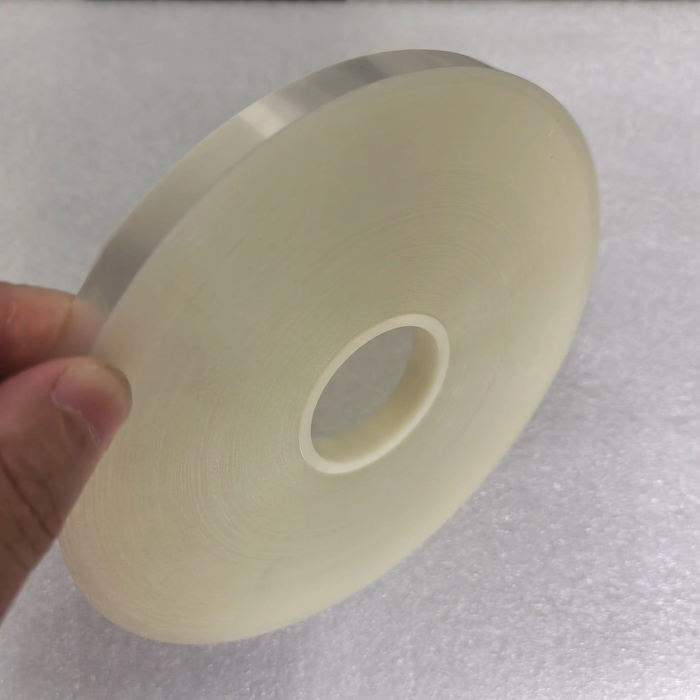Side view of transparent OPP hot melt strapping film roll for bundling machines