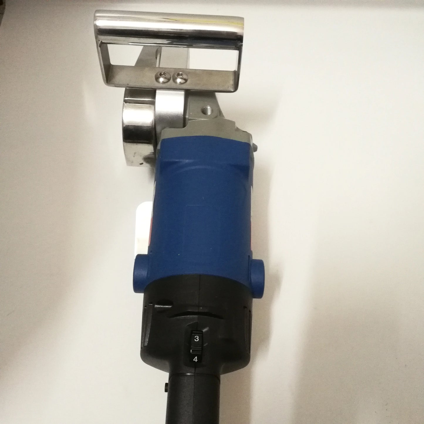 1400W carton waste stripping machine handle and chain assembly detail