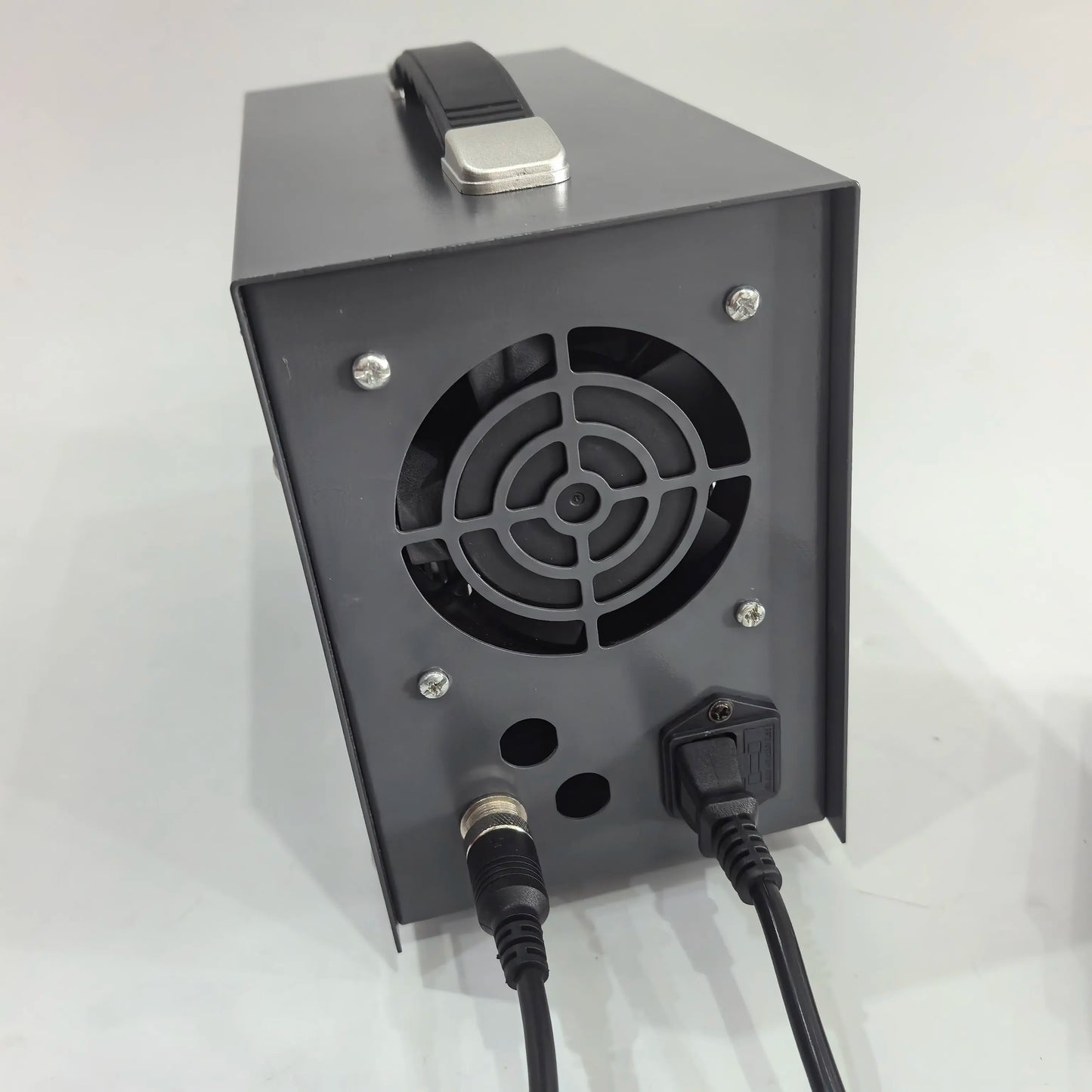 Rear panel of ultrasonic spot welder showing cooling fan and cable ports