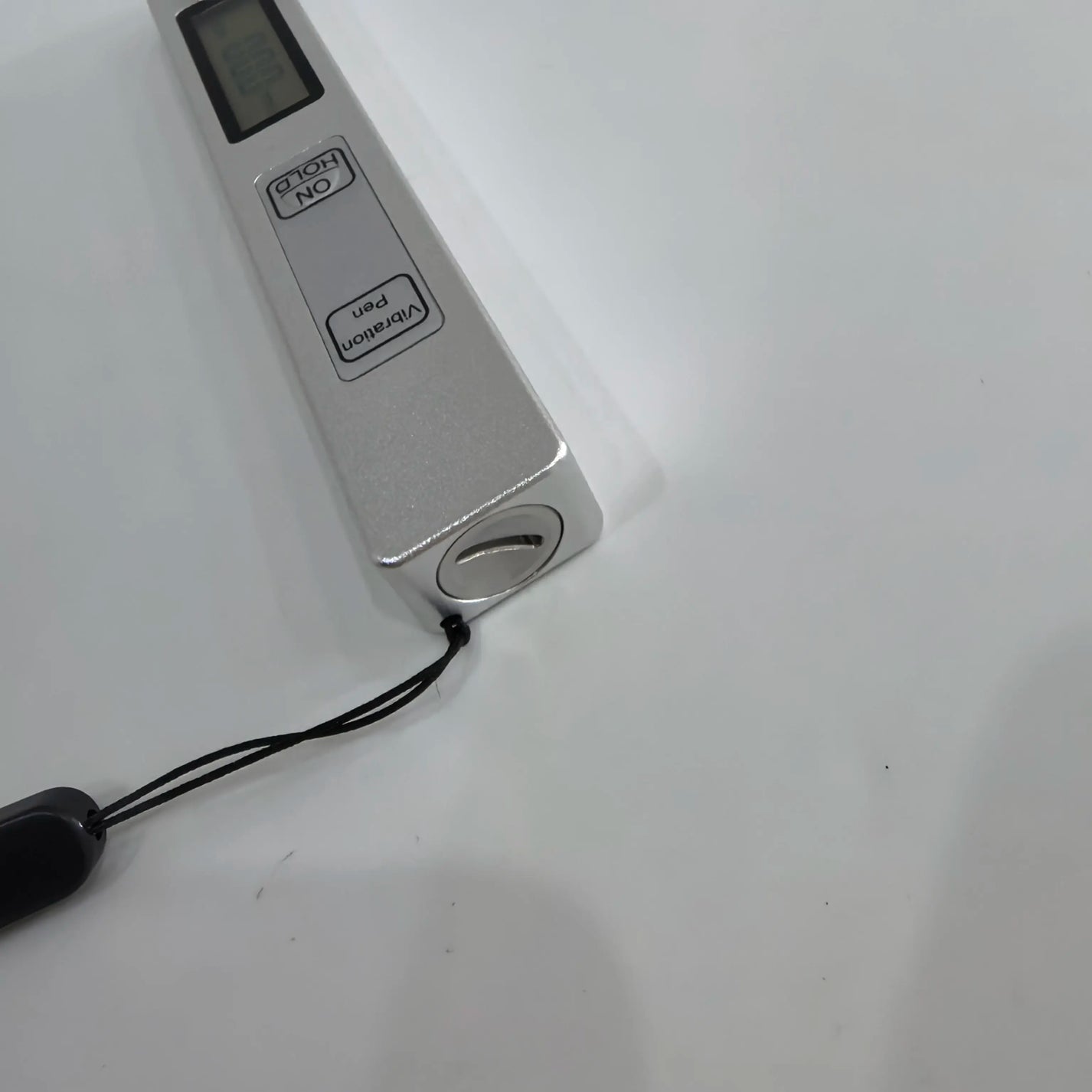 Pen-type vibration meter body with wrist strap and ON HOLD control