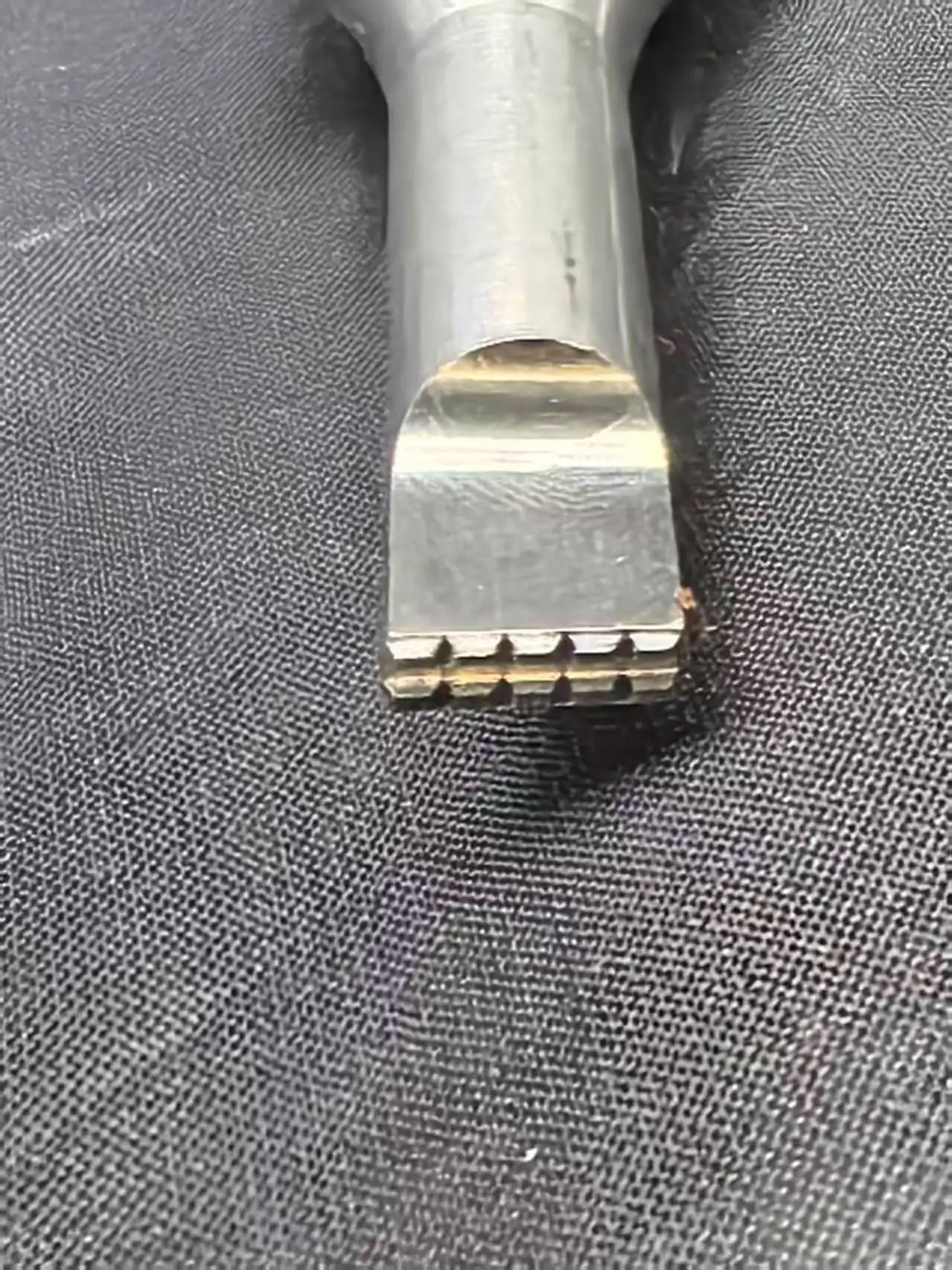 Multi-tooth ultrasonic welding horn tip close-up for plastic and fabric welding