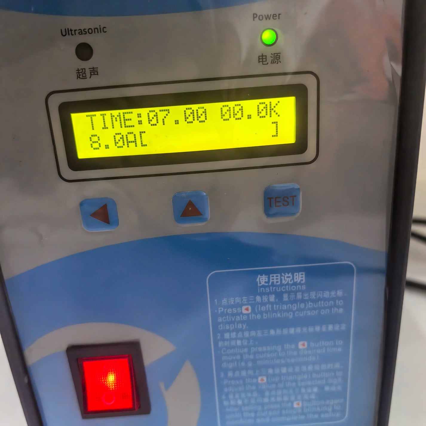 Ultrasonic spot welder front display and power switch close-up