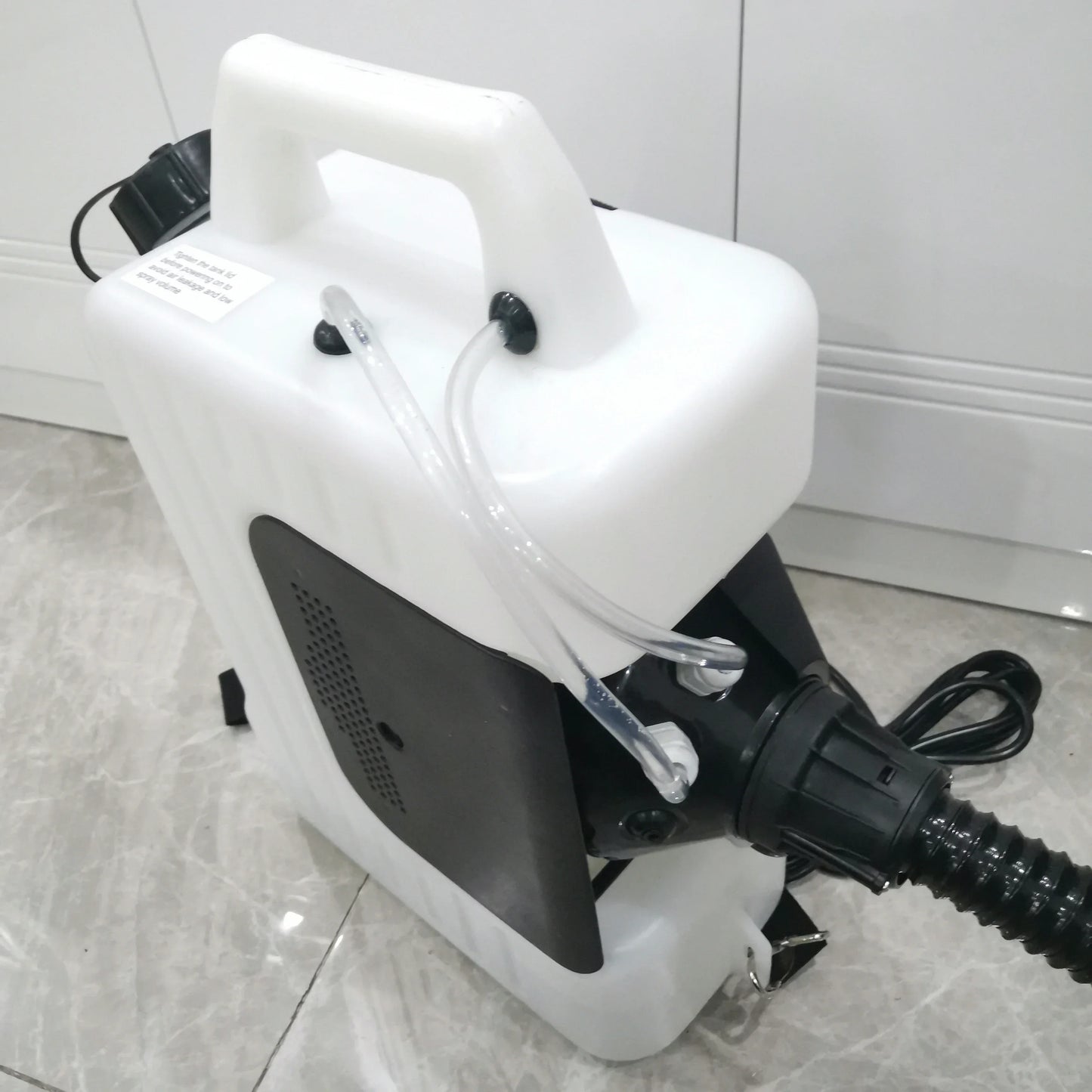 Top and side view of 10L electric fogger showing handle, tube lines and power cord