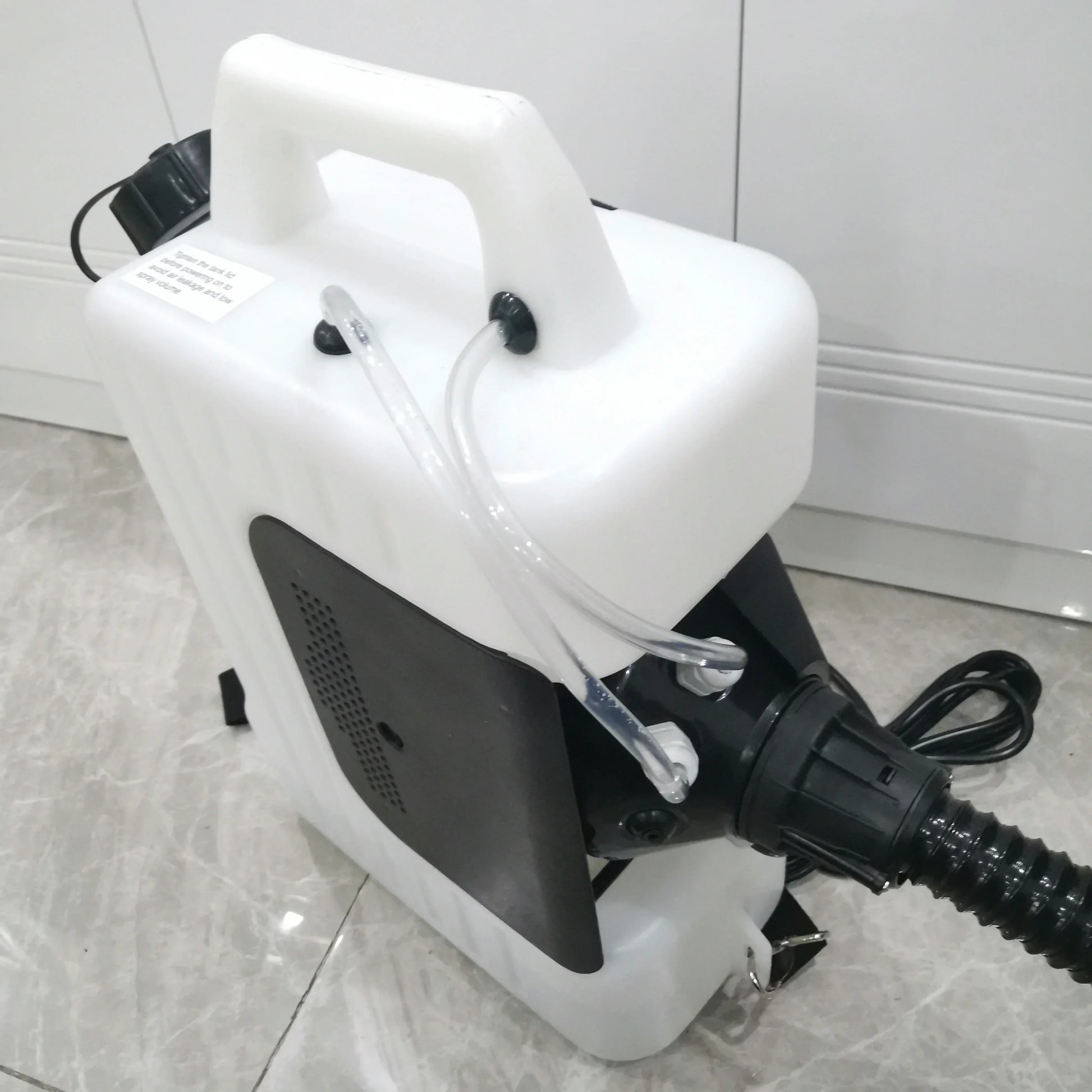 Top and side view of 10L electric fogger showing handle, tube lines and power cord