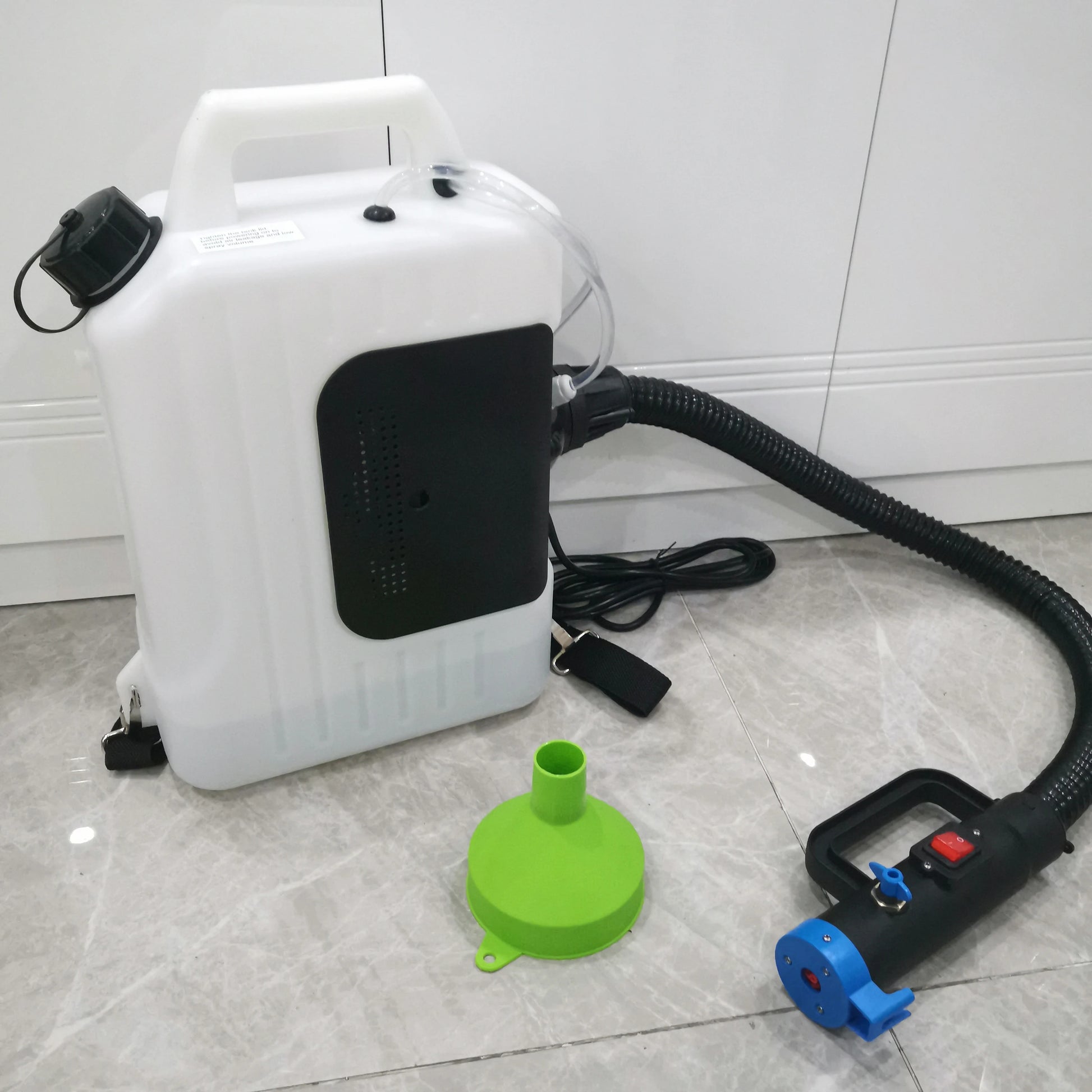 Back view of 10L backpack ULV fogger with hose, power cord and green filling funnel