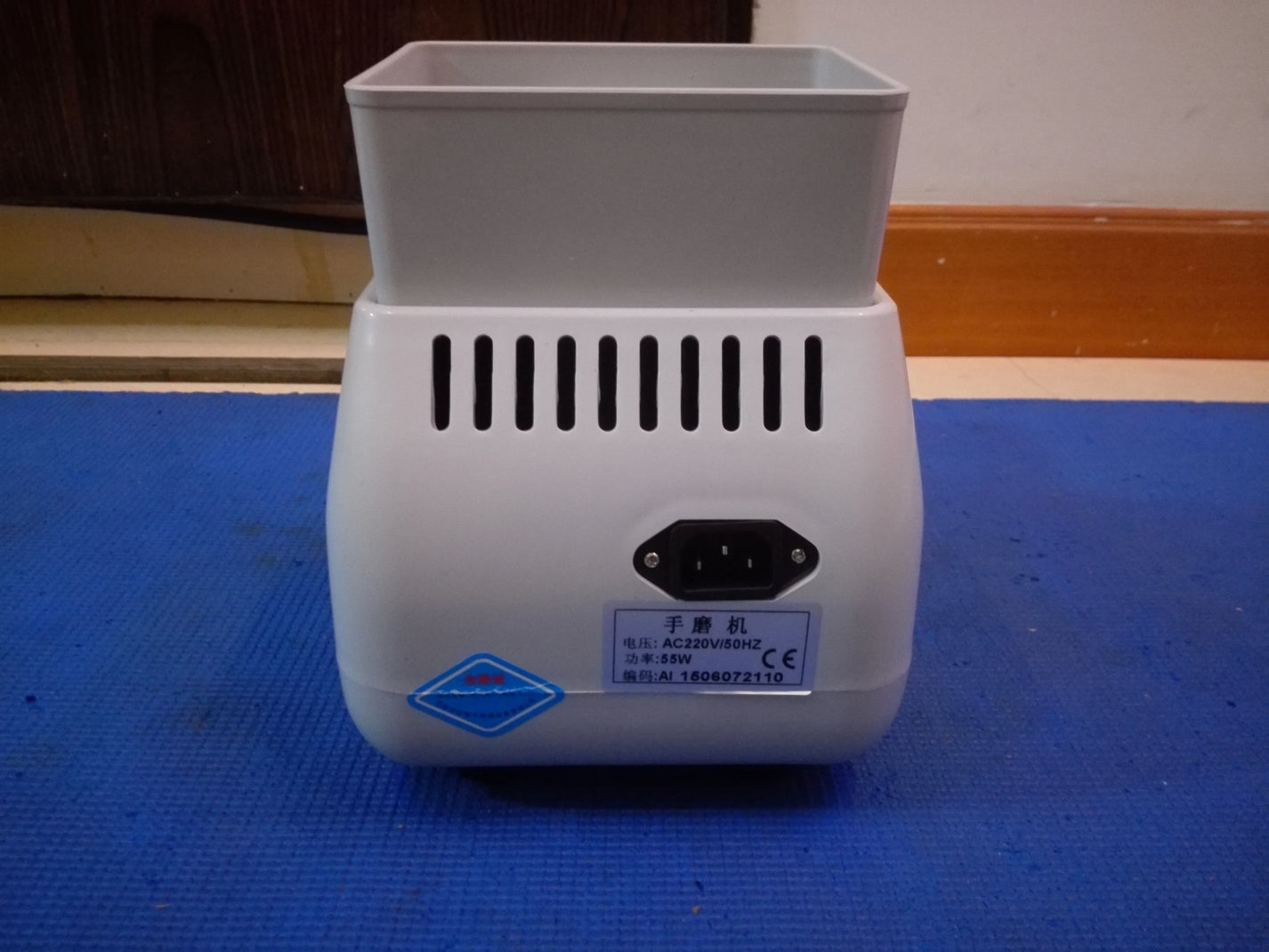 Rear label of HLE-35WV optical hand edger showing AC220V 50Hz and 55W marking