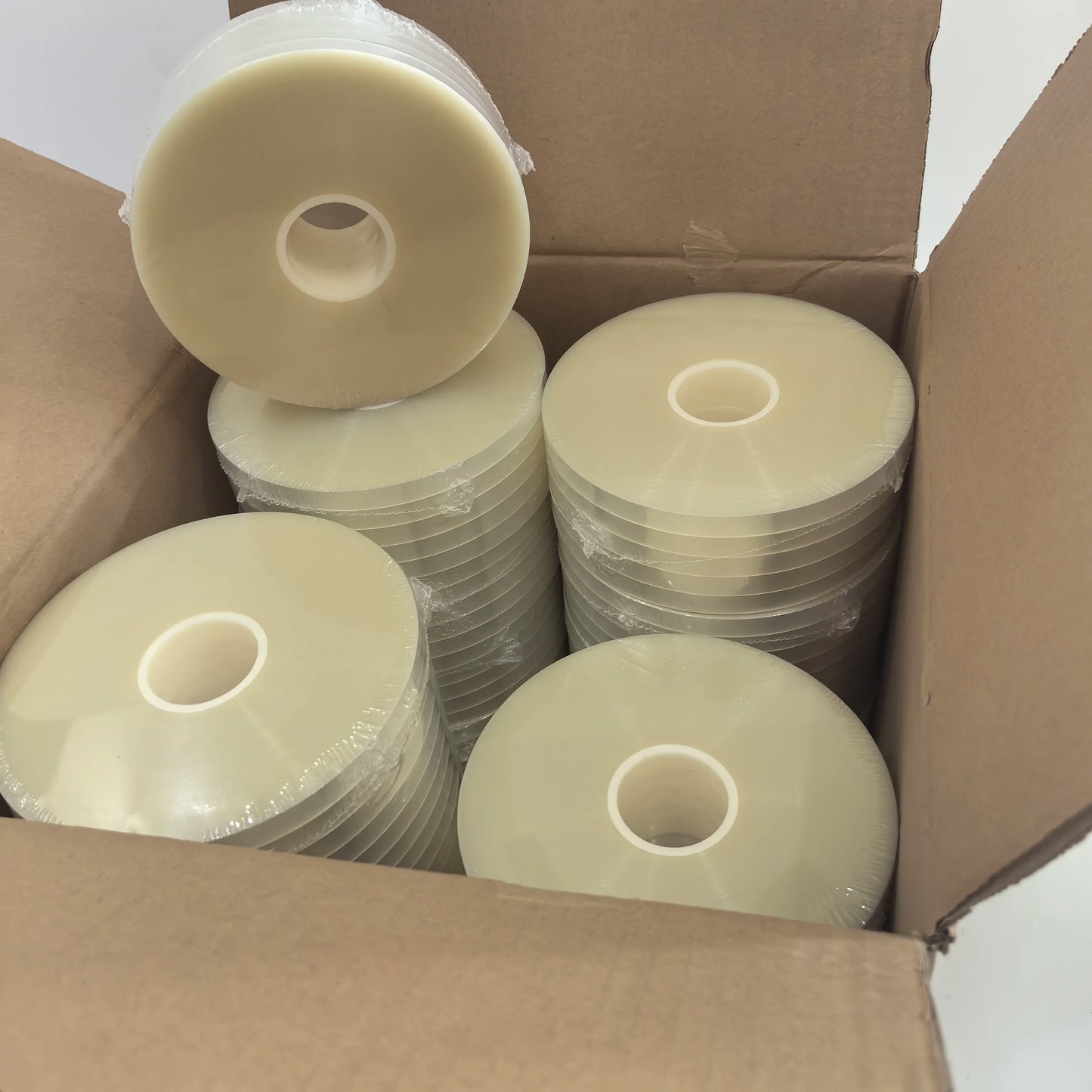Open carton of 100 rolls of 11mm transparent OPP strapping tape