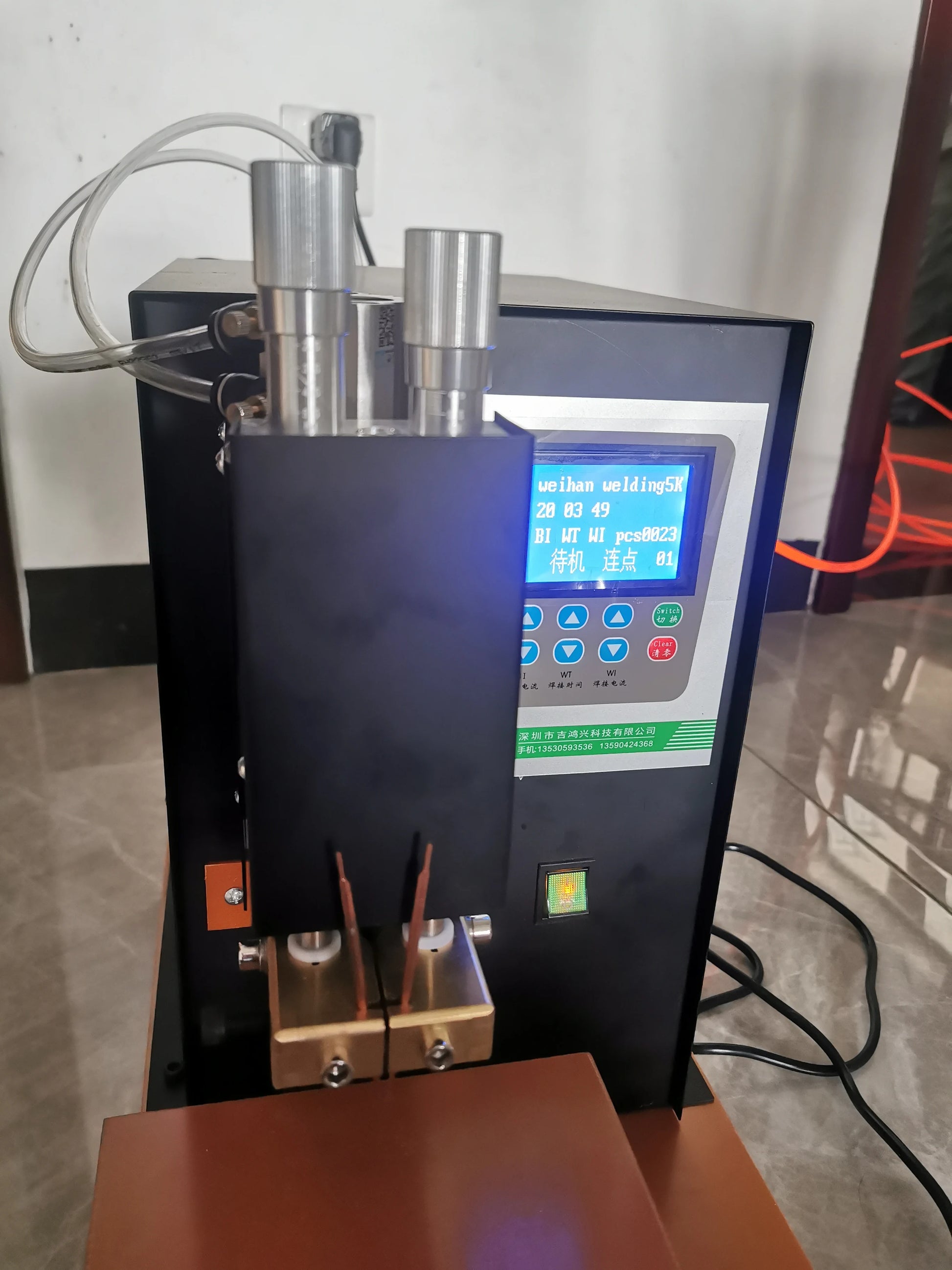 Front detail view of 15KVA pneumatic battery spot welder welding head