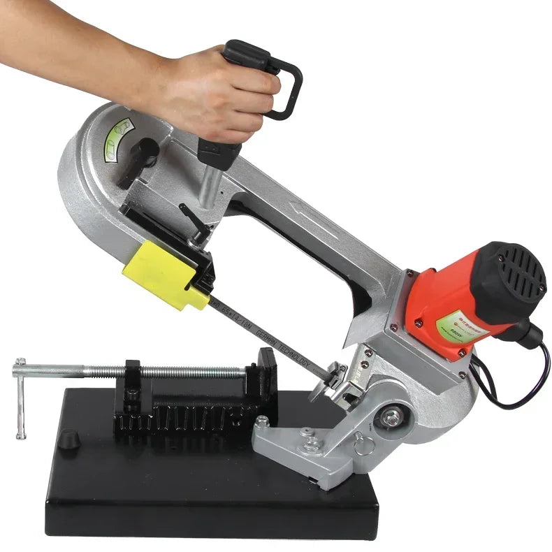 Portable band saw cutting angle demonstration with handle and clamp base